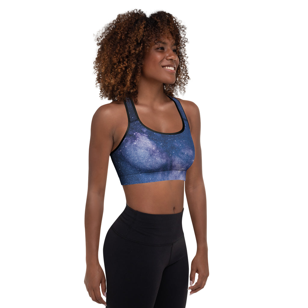 Blue galaxy-print women’s padded sports bra with black trim buttery soft supportive and quick-dry material