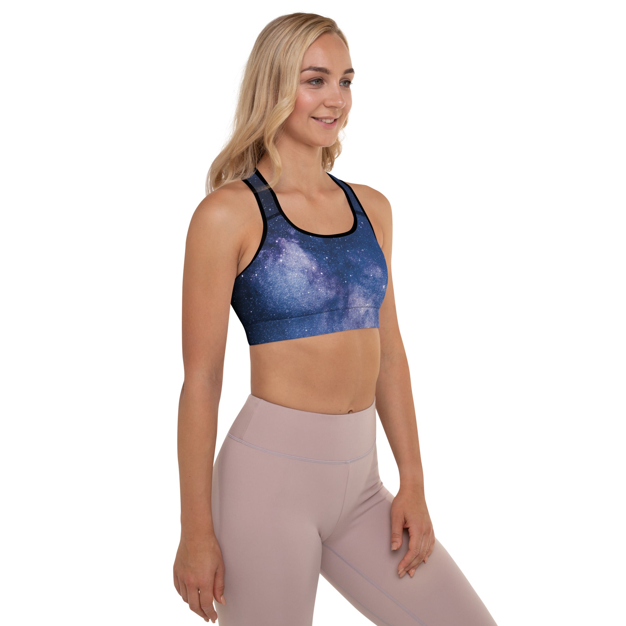 Blue galaxy-print padded sports bra with black trim made from buttery soft supportive quick-dry fabric
