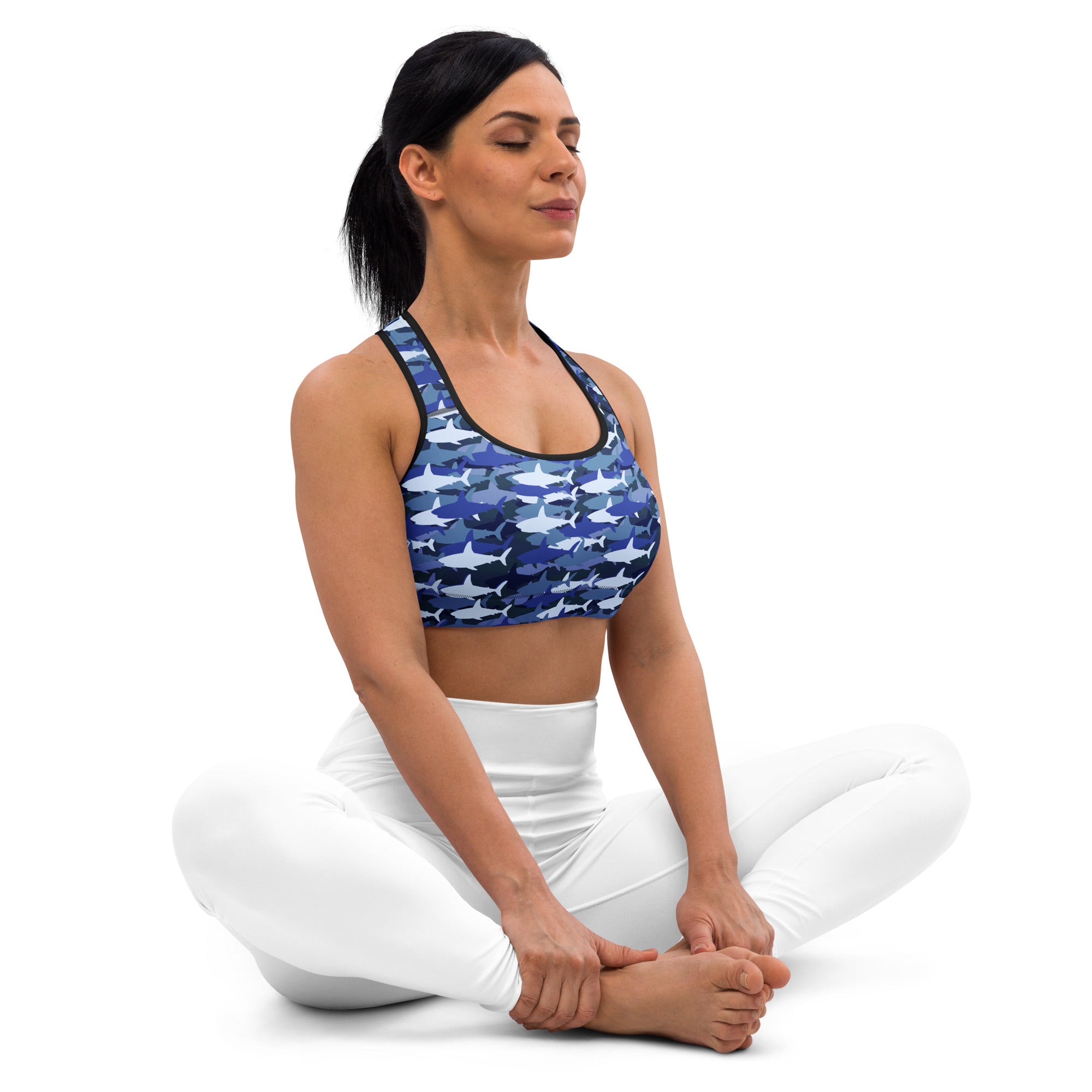 Women’s blue and white shark-patterned padded sports bra with black trim buttery soft supportive and quick-dry