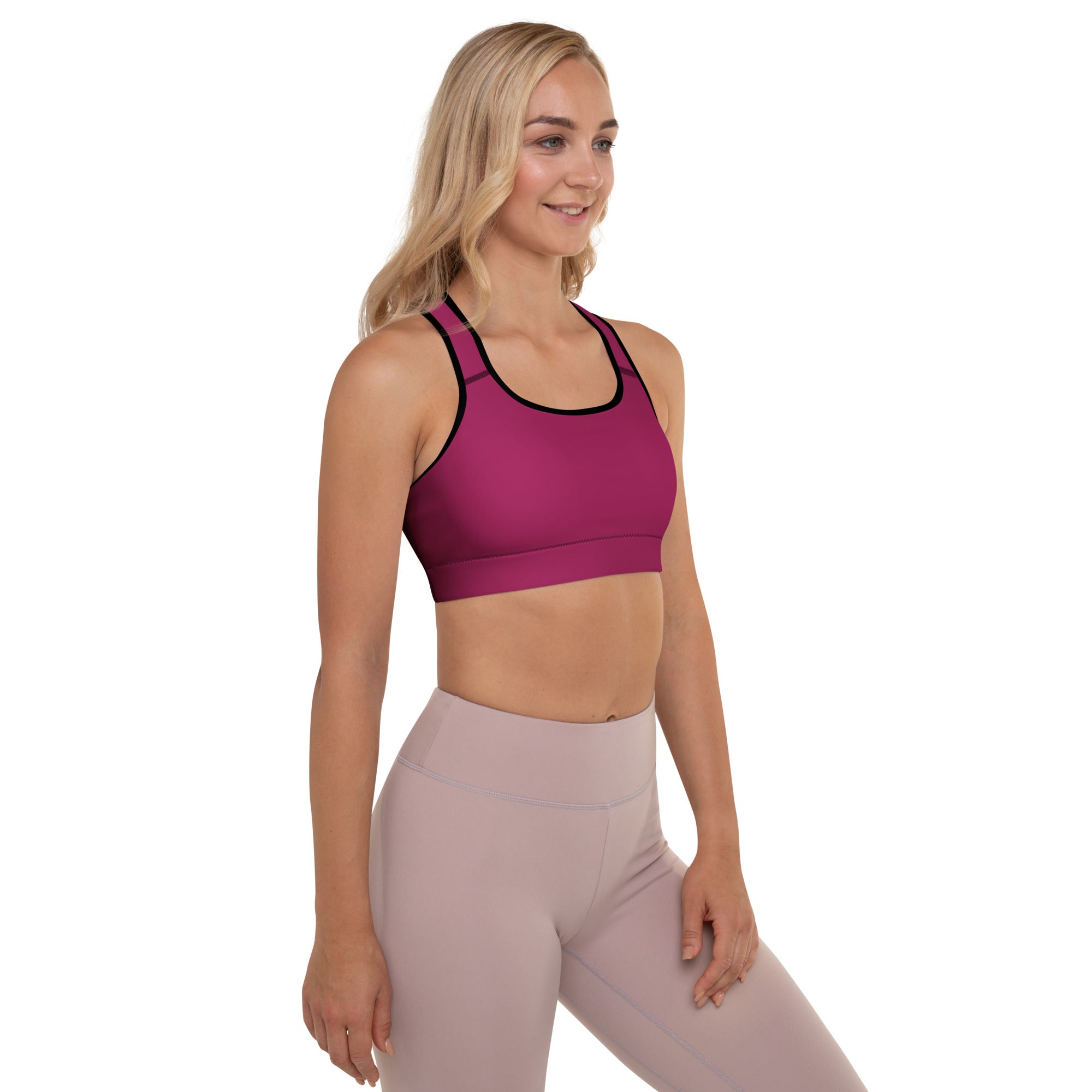 Women’s burgundy padded sports bra with magenta color, black trim, buttery soft fabric, supportive and quick-dry design