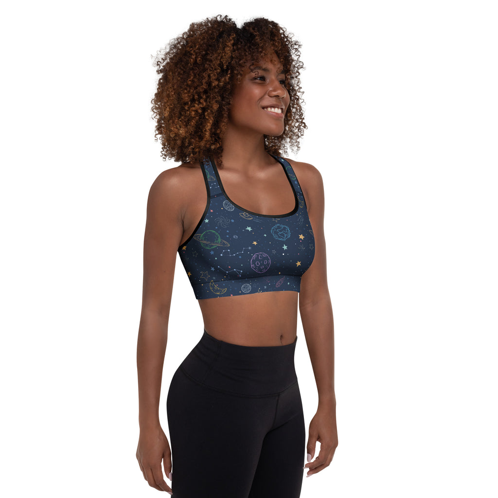Dark blue space-themed padded sports bra with gold and white celestial patterns, buttery soft and quick-dry fabric