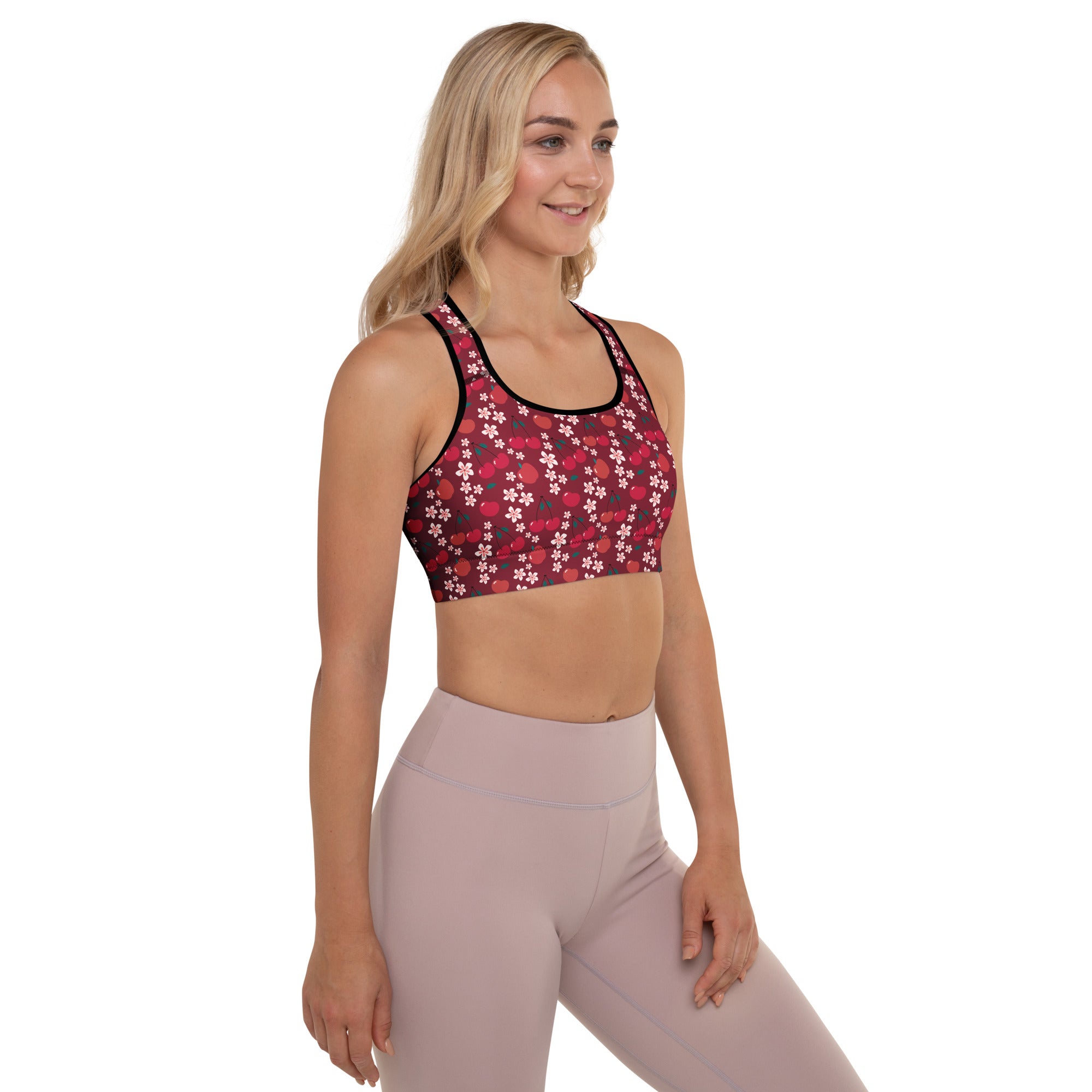 Women’s burgundy cherry blossom padded sports bra with buttery soft fabric, delicate white floral pattern, and black trim