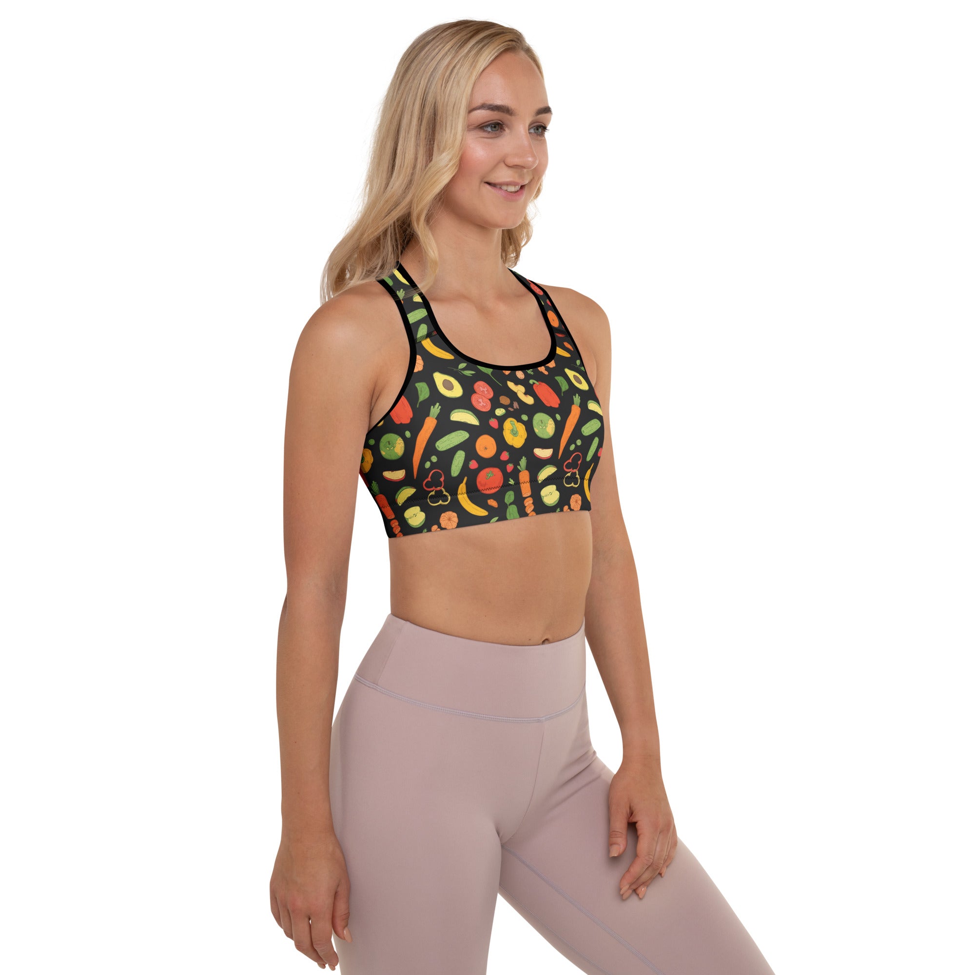 Black padded sports bra with vibrant fruit and vegetable print buttery soft supportive and quick dry fabric
