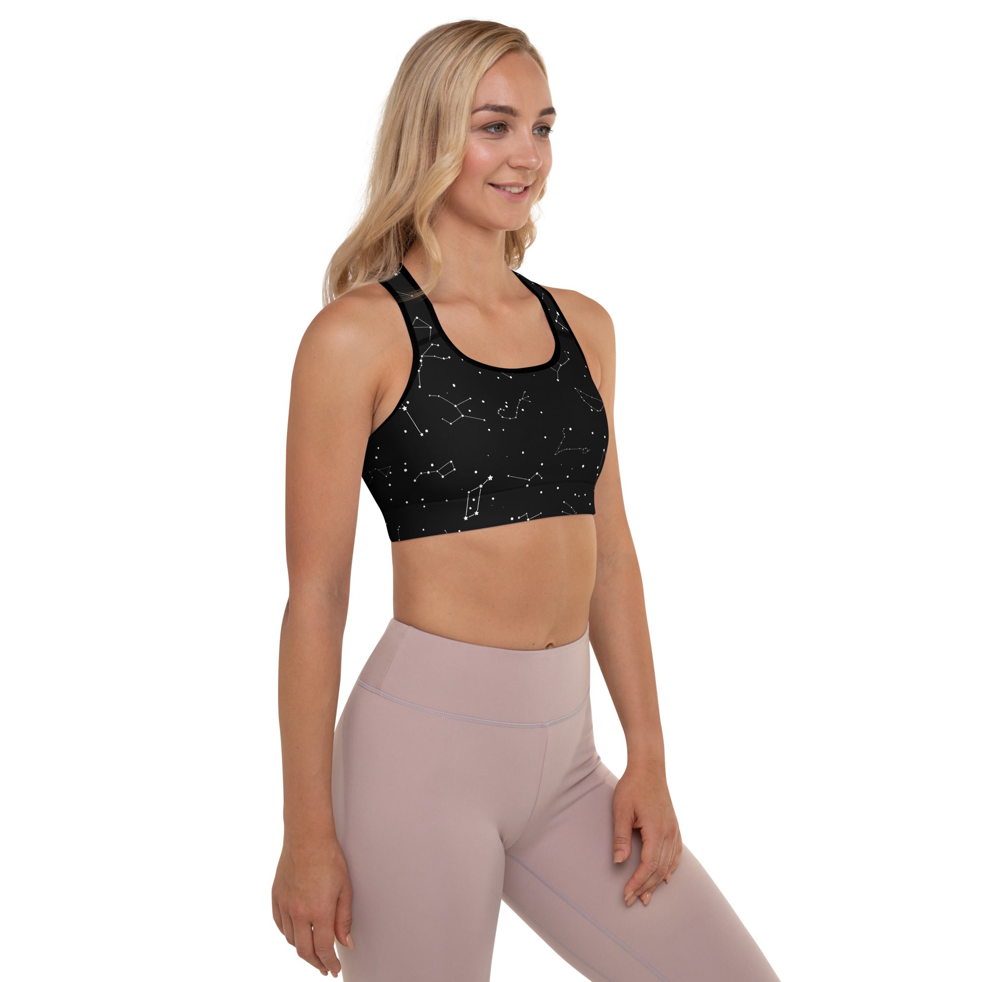Black womens padded sports bra with white realistic constellation pattern buttery soft supportive quick dry material