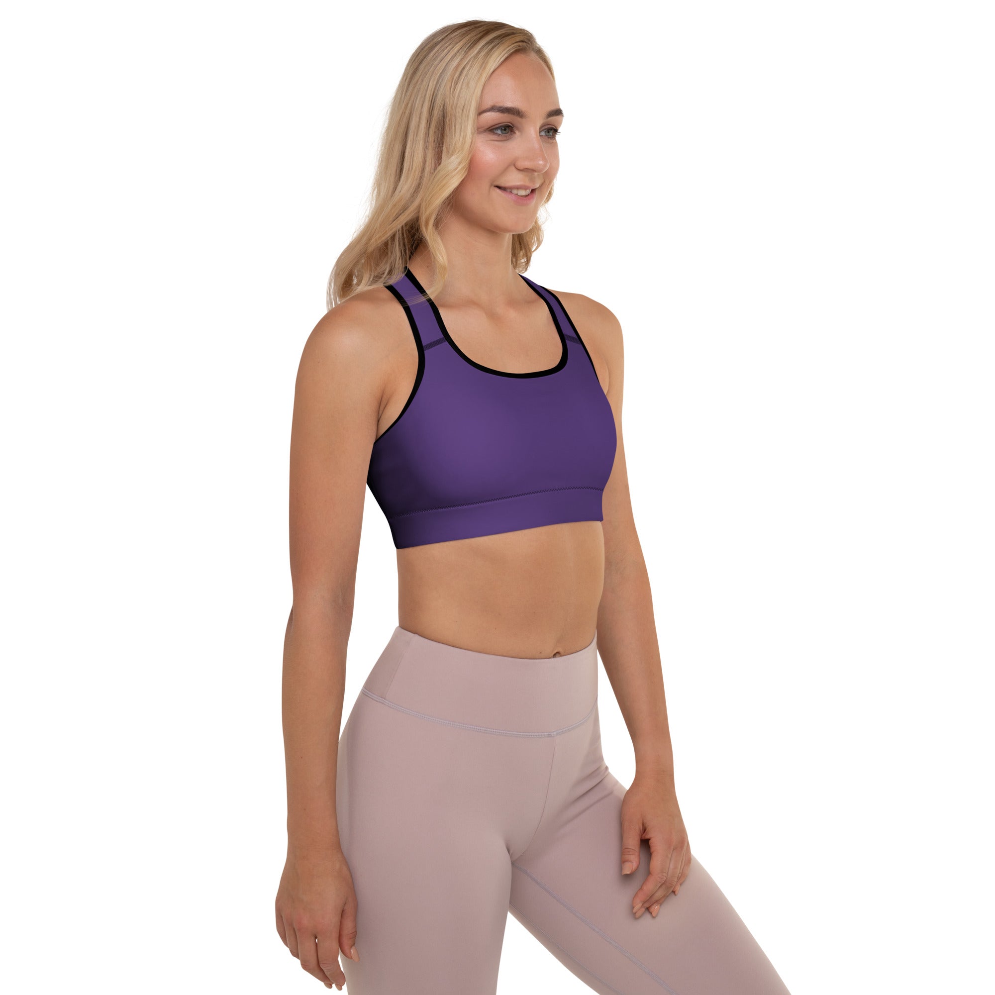 Women’s dark purple padded sports bra with black trim, buttery soft material, supportive fit, and quick-dry fabric
