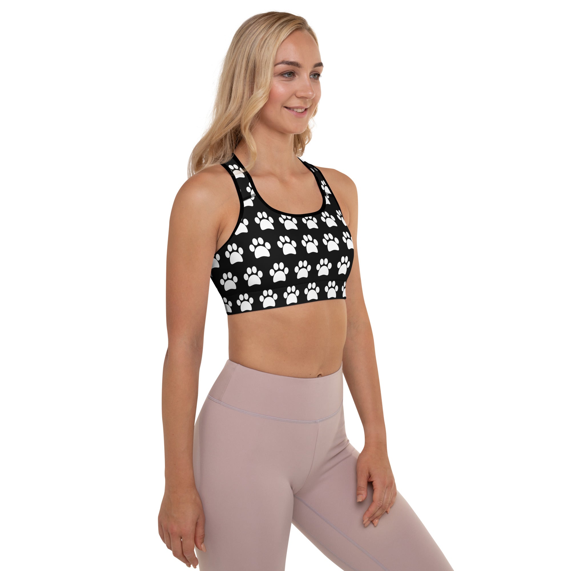 Women’s black paw print padded sports bra with white pattern buttery soft supportive and quick-dry material