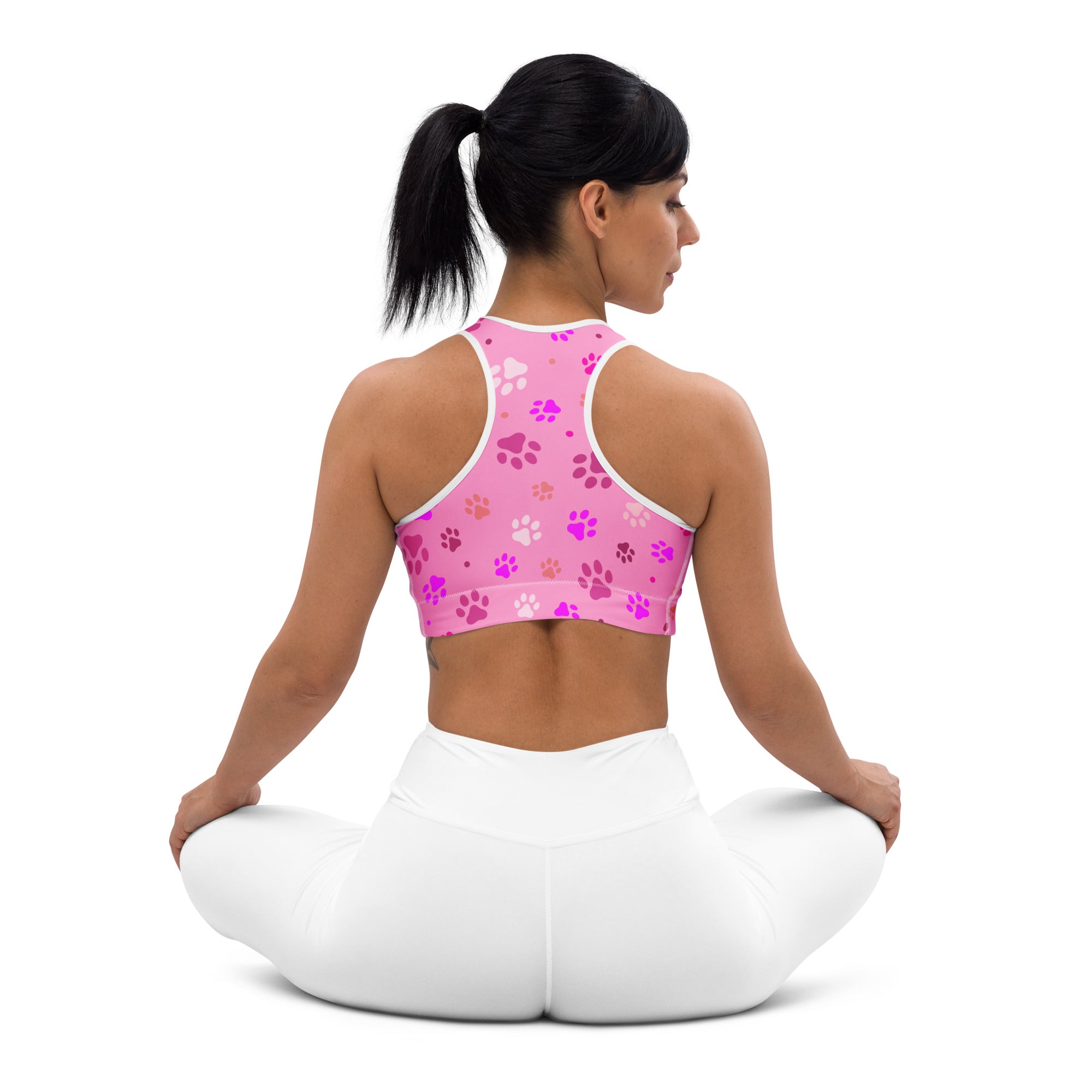 Women’s pink padded sports bra with white and purple paw print pattern buttery soft supportive quick-dry