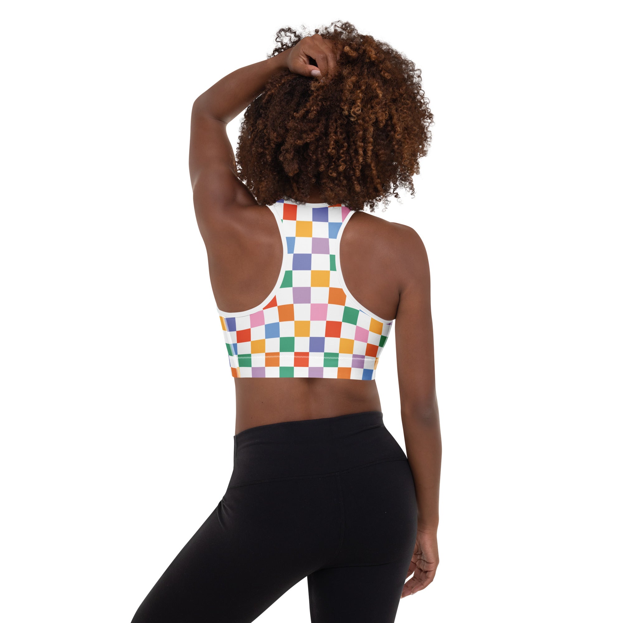 Women’s colorful checkerboard padded sports bra with white base, vibrant rainbow squares, buttery soft and quick-dry fabric