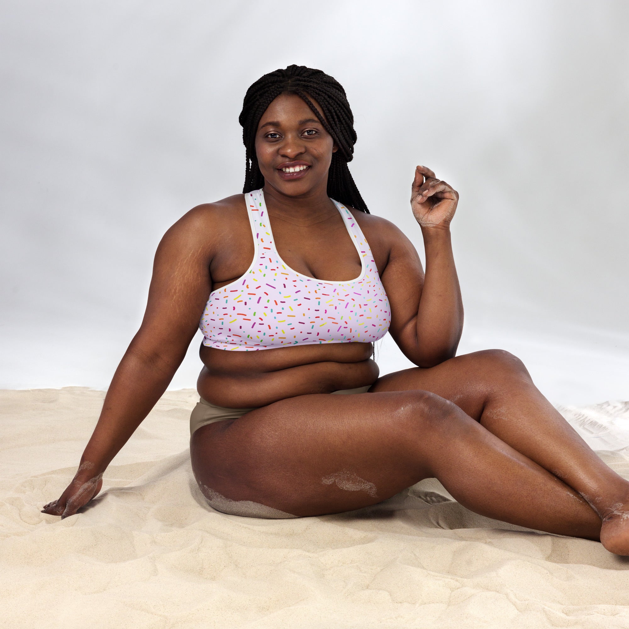 Women’s white padded sports bra with colorful sprinkle patterns buttery soft supportive and quick-dry fabric