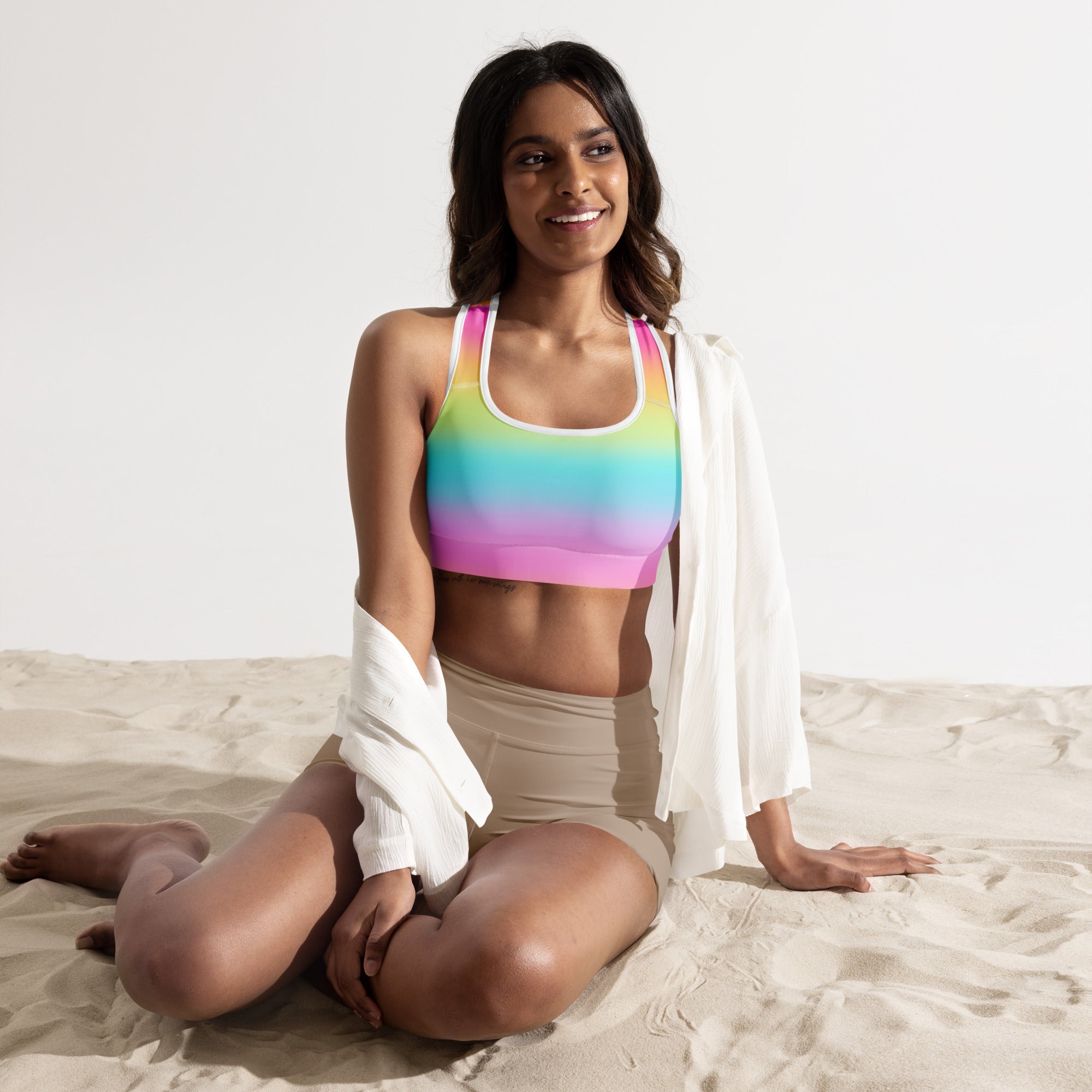Women’s bright rainbow padded sports bra with white trim made from buttery soft supportive quick-dry fabric