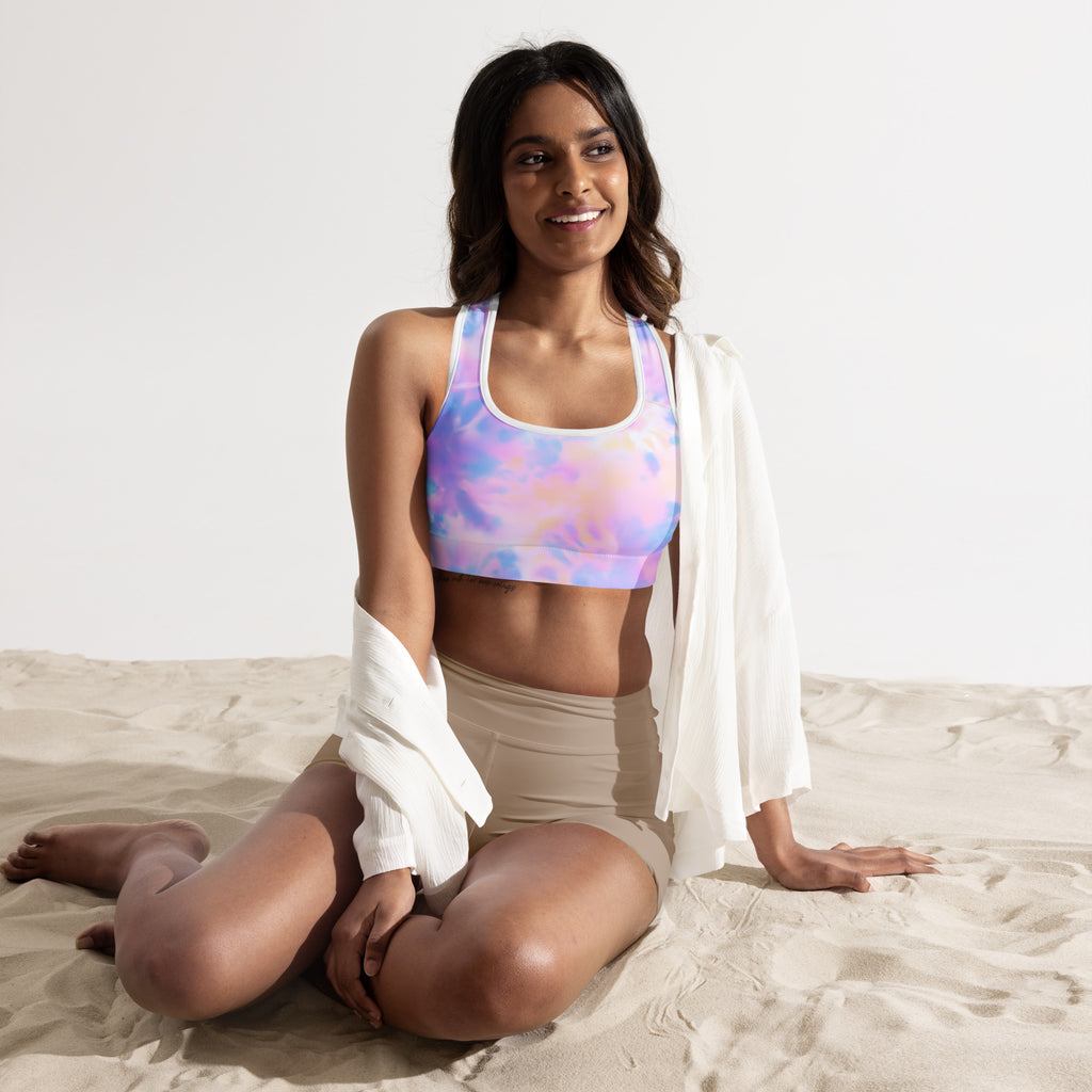 Pastel tie-dye women’s padded sports bra with racerback design made of buttery soft quick-dry fabric shown from back
