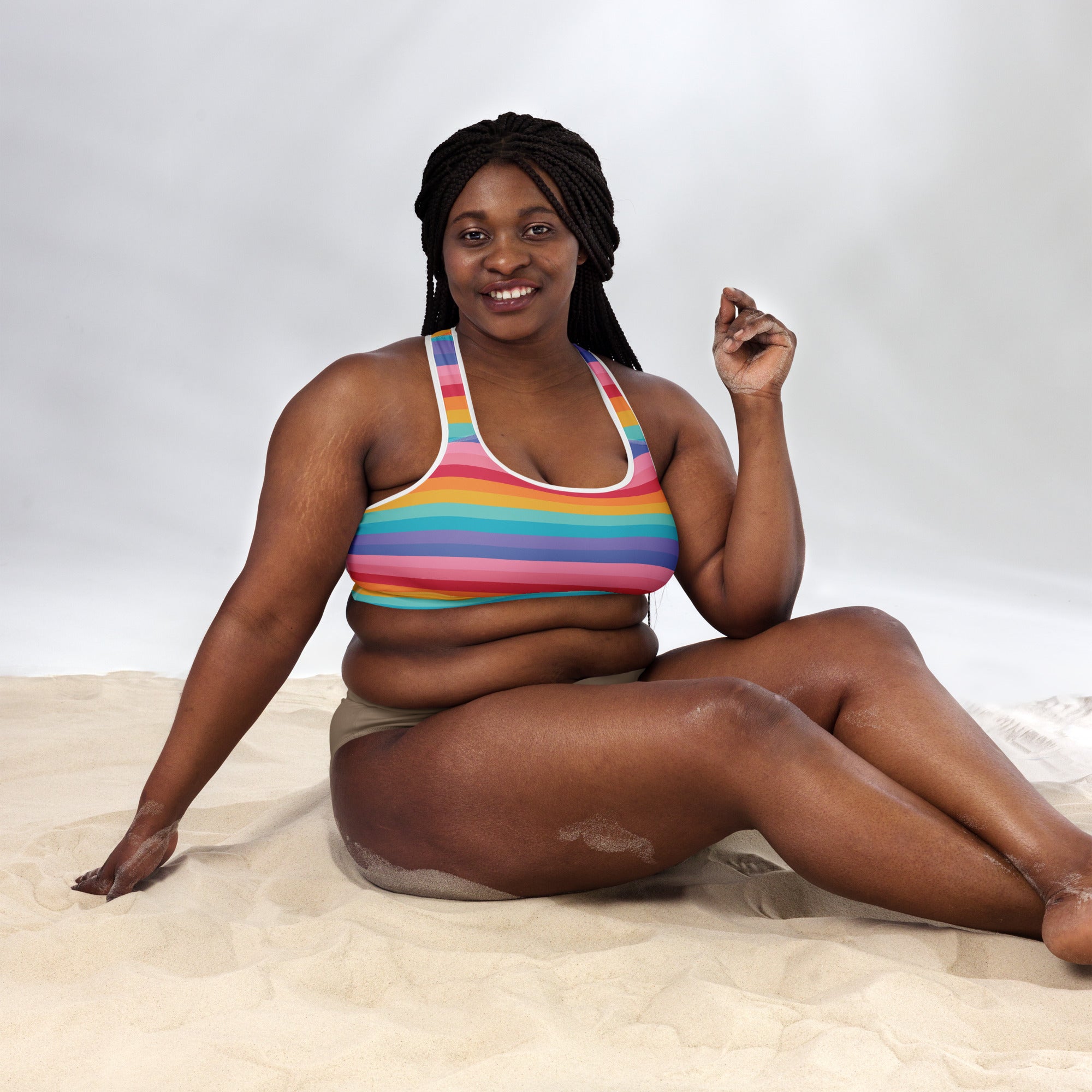 Women’s bright striped rainbow padded sports bra with white trim buttery soft supportive and quick dry fabric