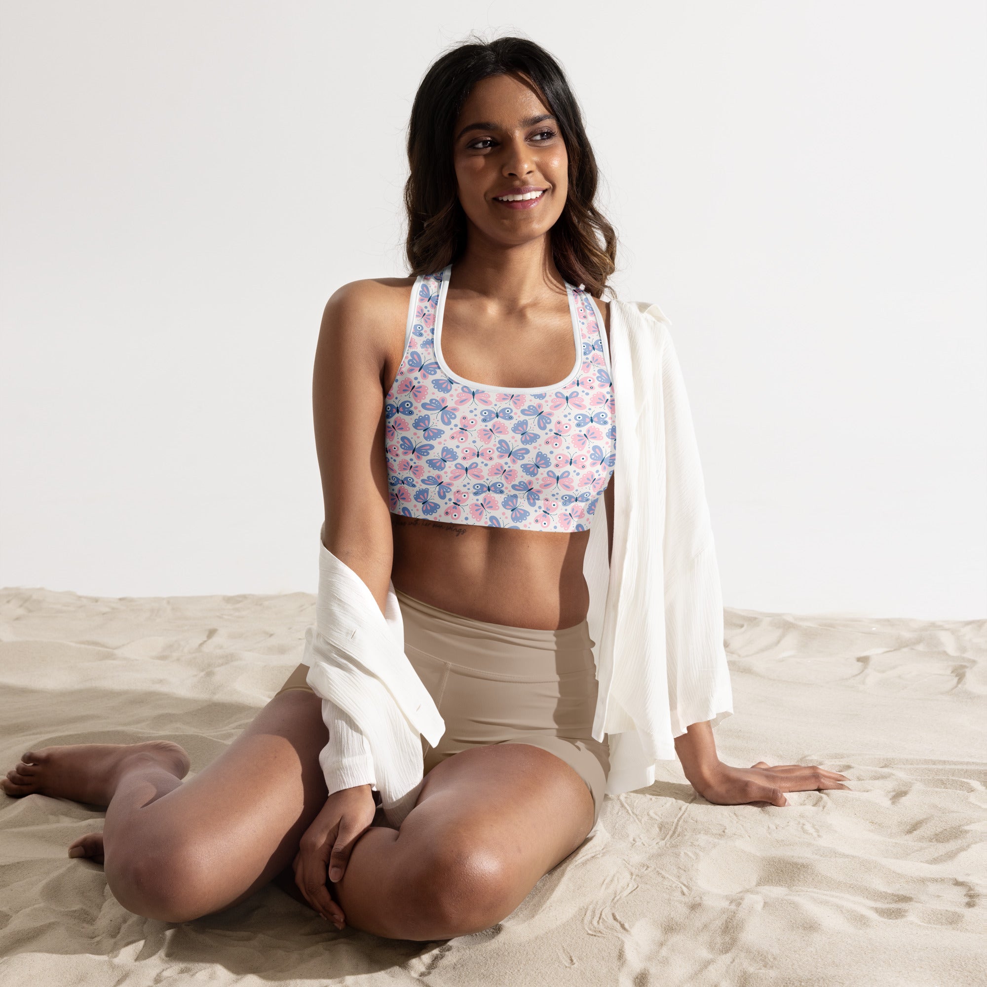 Women’s pastel butterfly print padded sports bra in pink and blue with white trim, buttery soft, supportive, and quick-dry