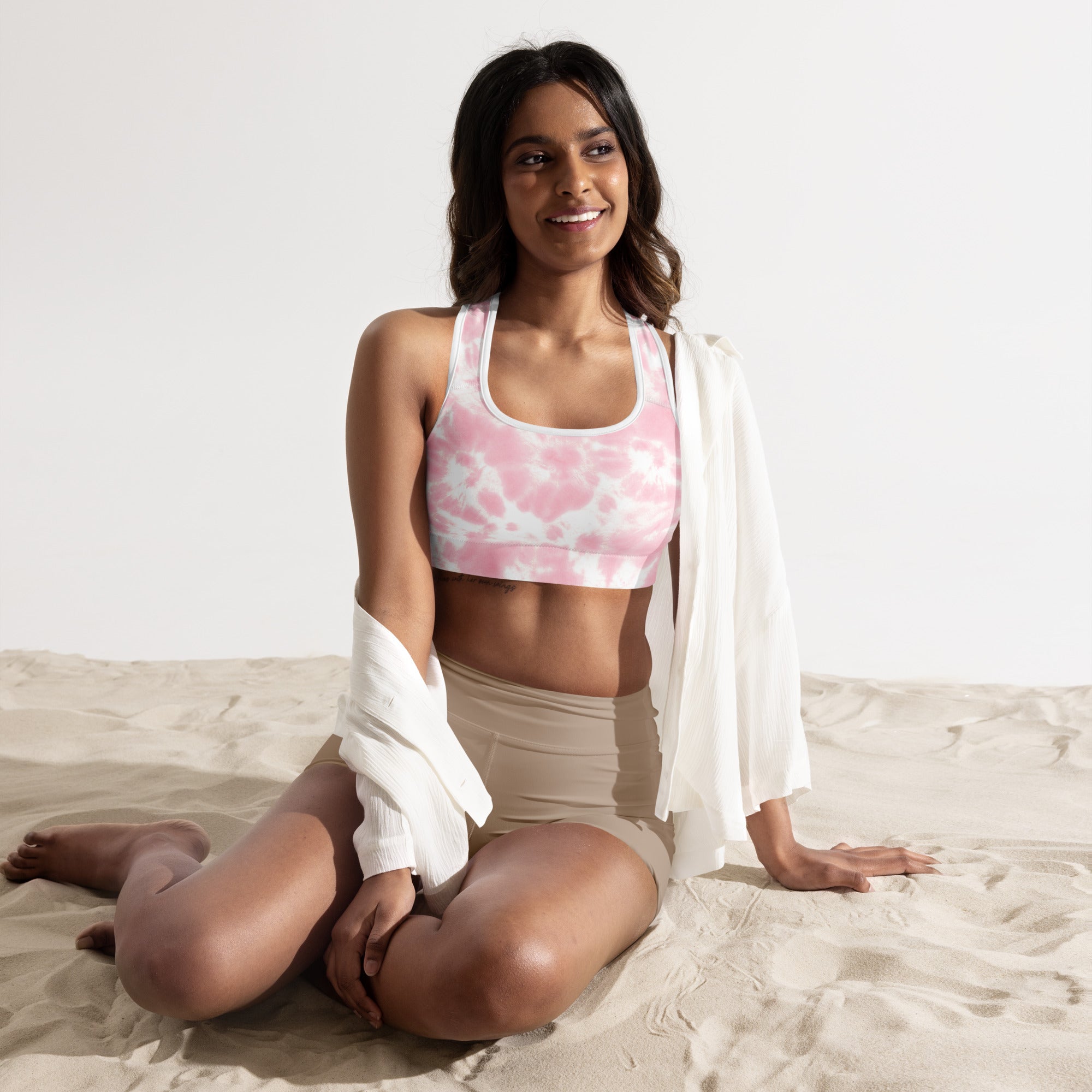 Women’s pink and white tie dye padded sports bra with buttery soft fabric and supportive racerback design
