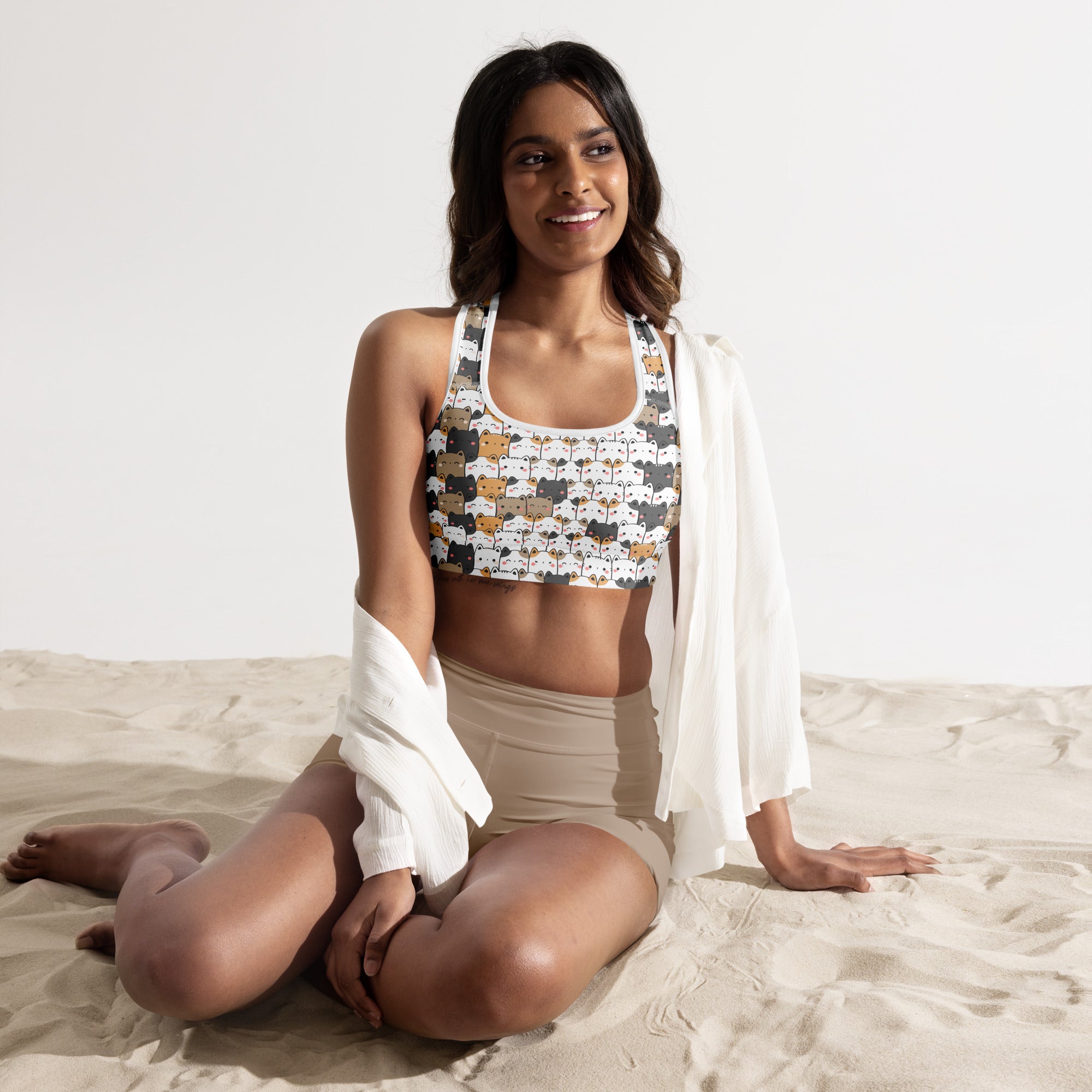 White kawaii cat padded sports bra with multicolored cartoon cats, buttery soft, supportive, and quick-dry material