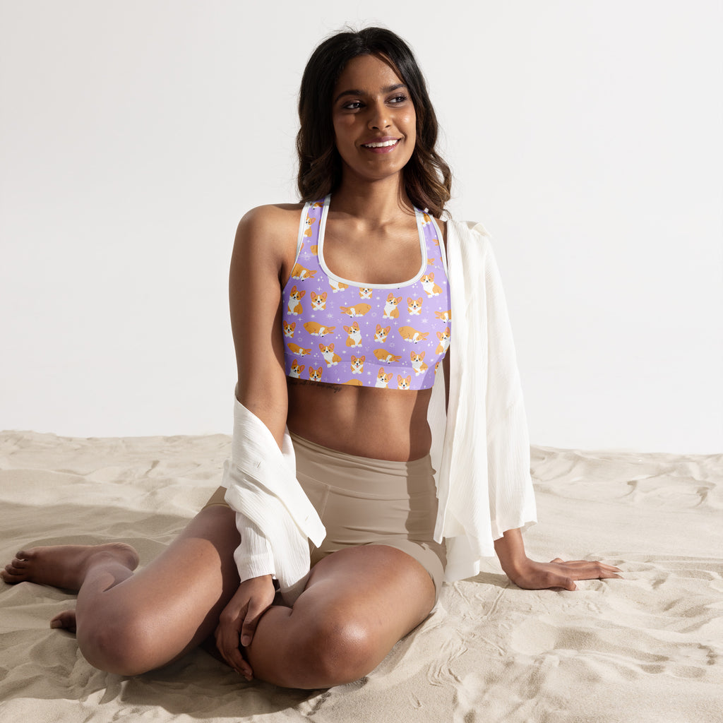Women’s purple corgi dog padded sports bra with playful orange and white corgi pattern buttery soft and quick dry
