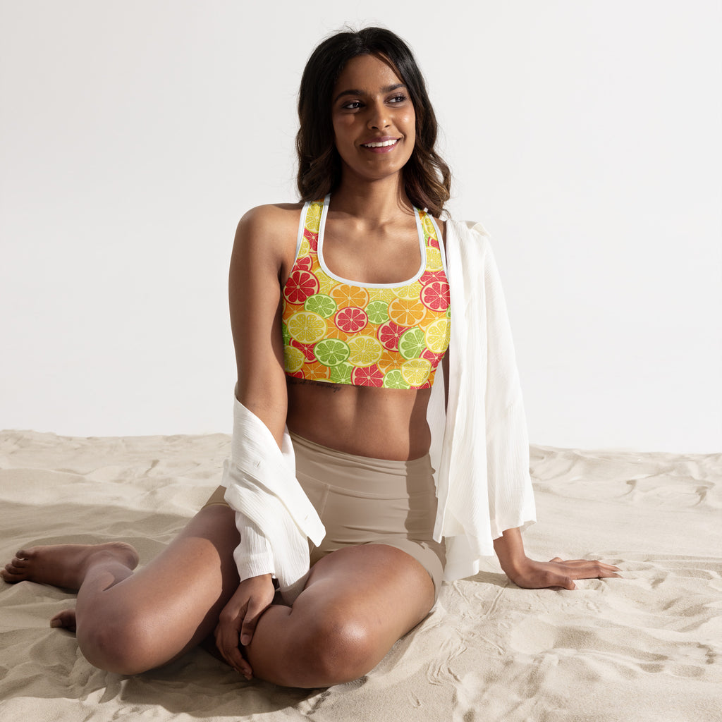 A vibrant yellow women’s citrus slice padded sports bra with a playful fruit pattern buttery soft and quick dry