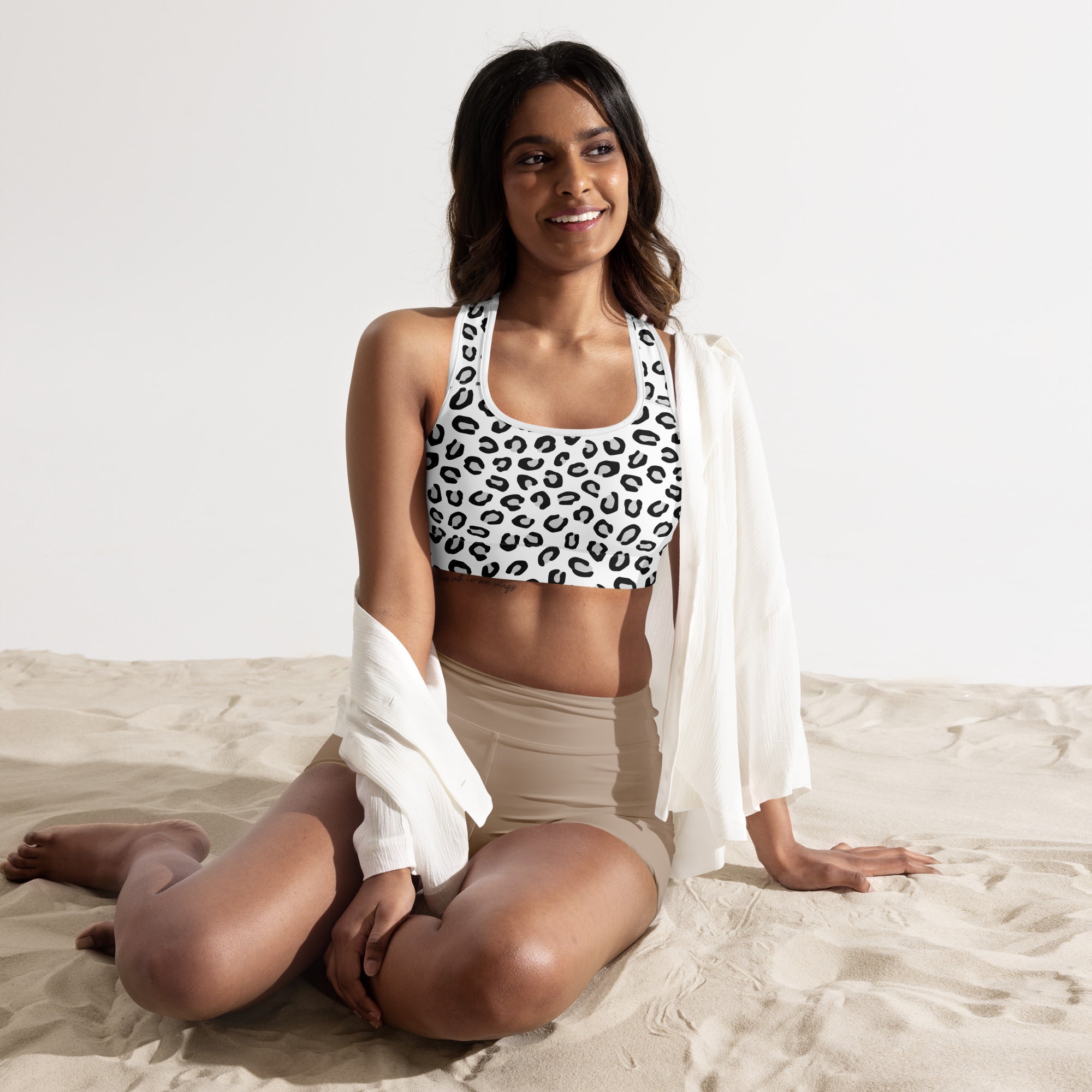 Women’s black and white leopard print padded sports bra in buttery soft fabric with supportive quick-dry design