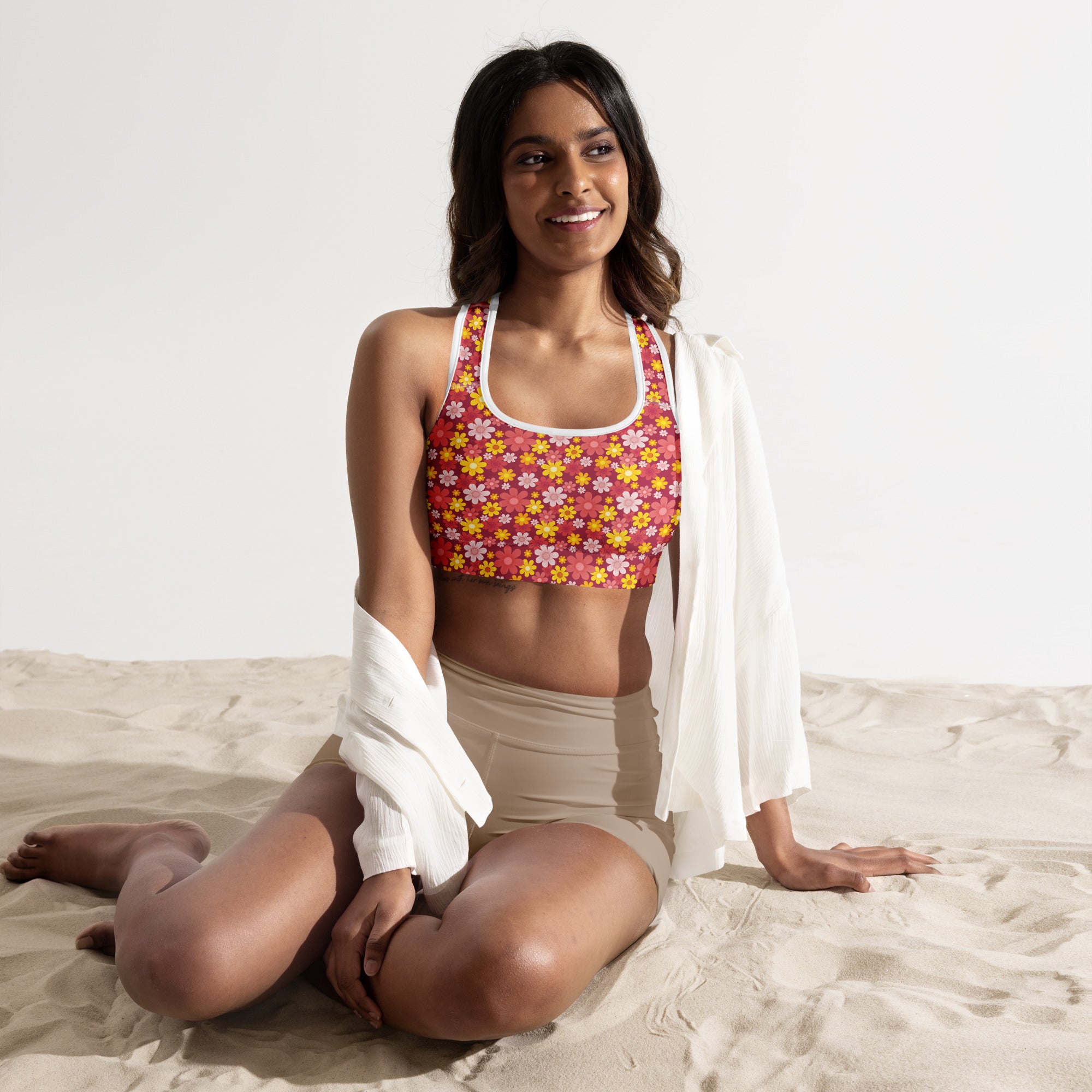 Women’s red floral padded sports bra with vibrant pink and yellow print white trim buttery soft supportive quick-dry
