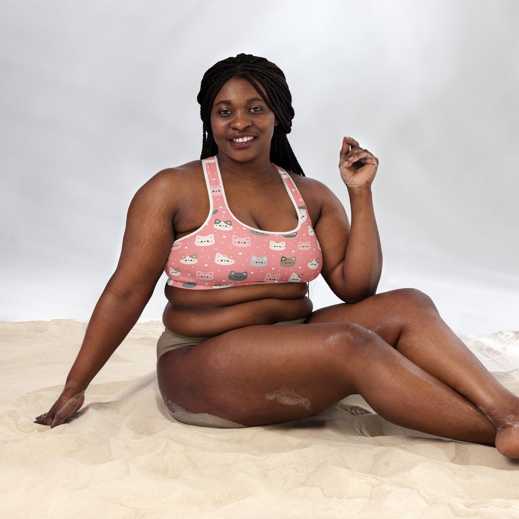 Women’s pink cat-patterned padded sports bra with white trim made of buttery soft supportive quick-dry fabric