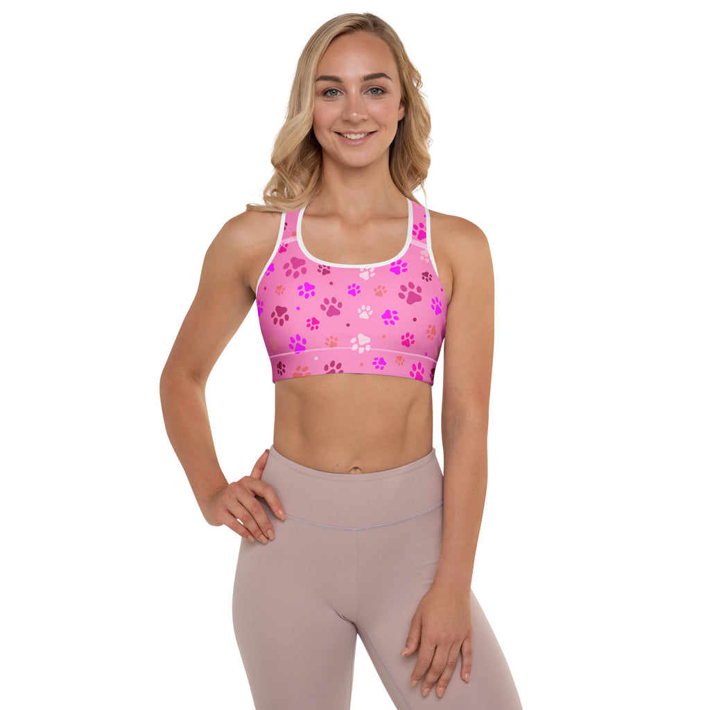 Women’s pink paw print padded sports bra with playful pattern, white trim, buttery soft, supportive, and quick-dry material