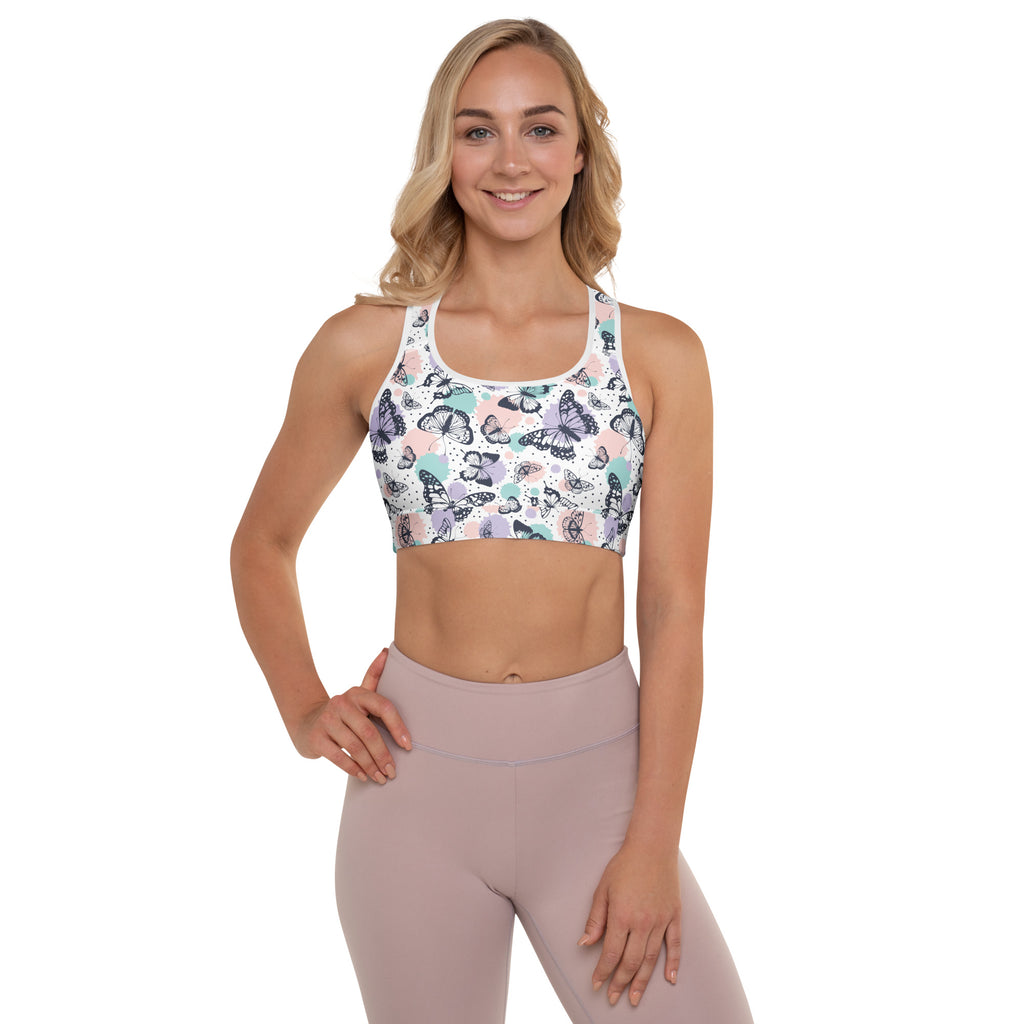 White butterfly patterned women’s padded sports bra with pastel accents, buttery soft, supportive, and quick dry