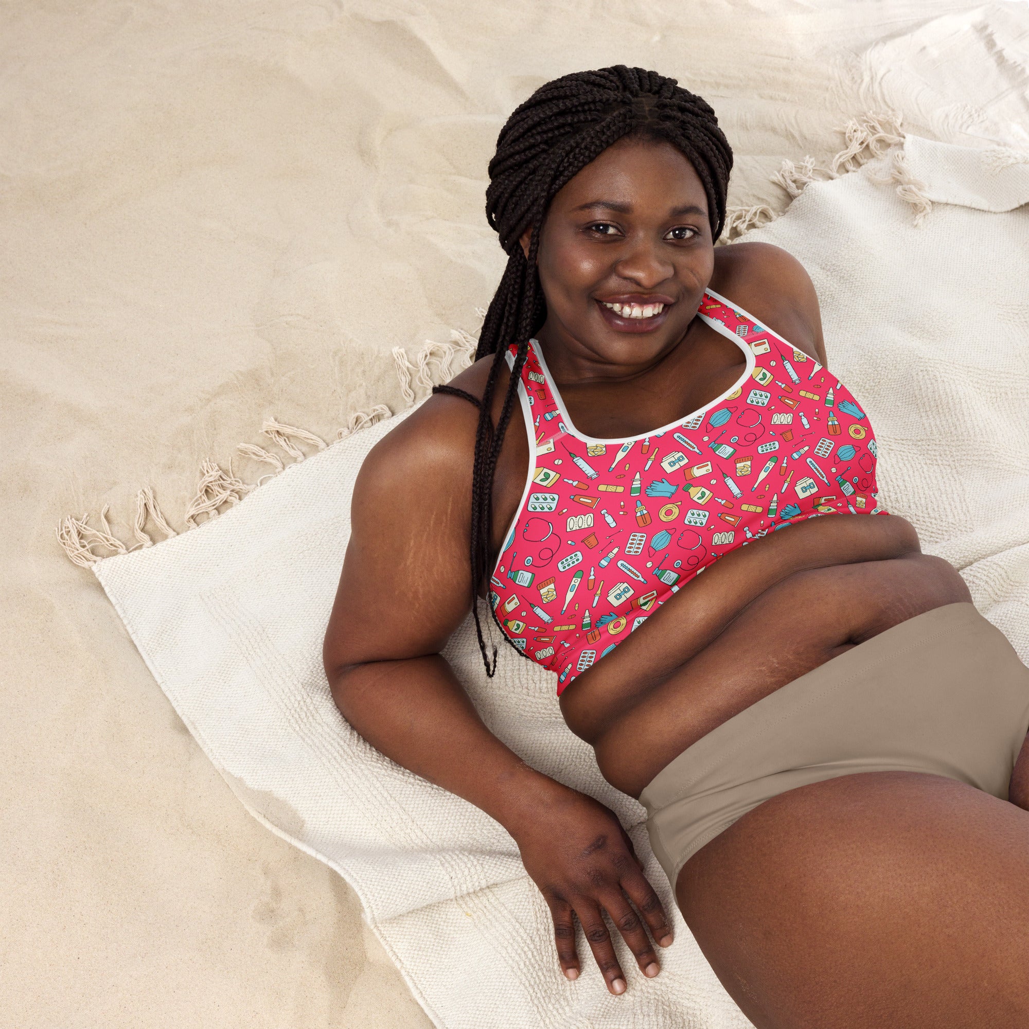 Women’s nurse padded sports bra in pink with playful medical icons white trim buttery soft supportive quick-dry fabric