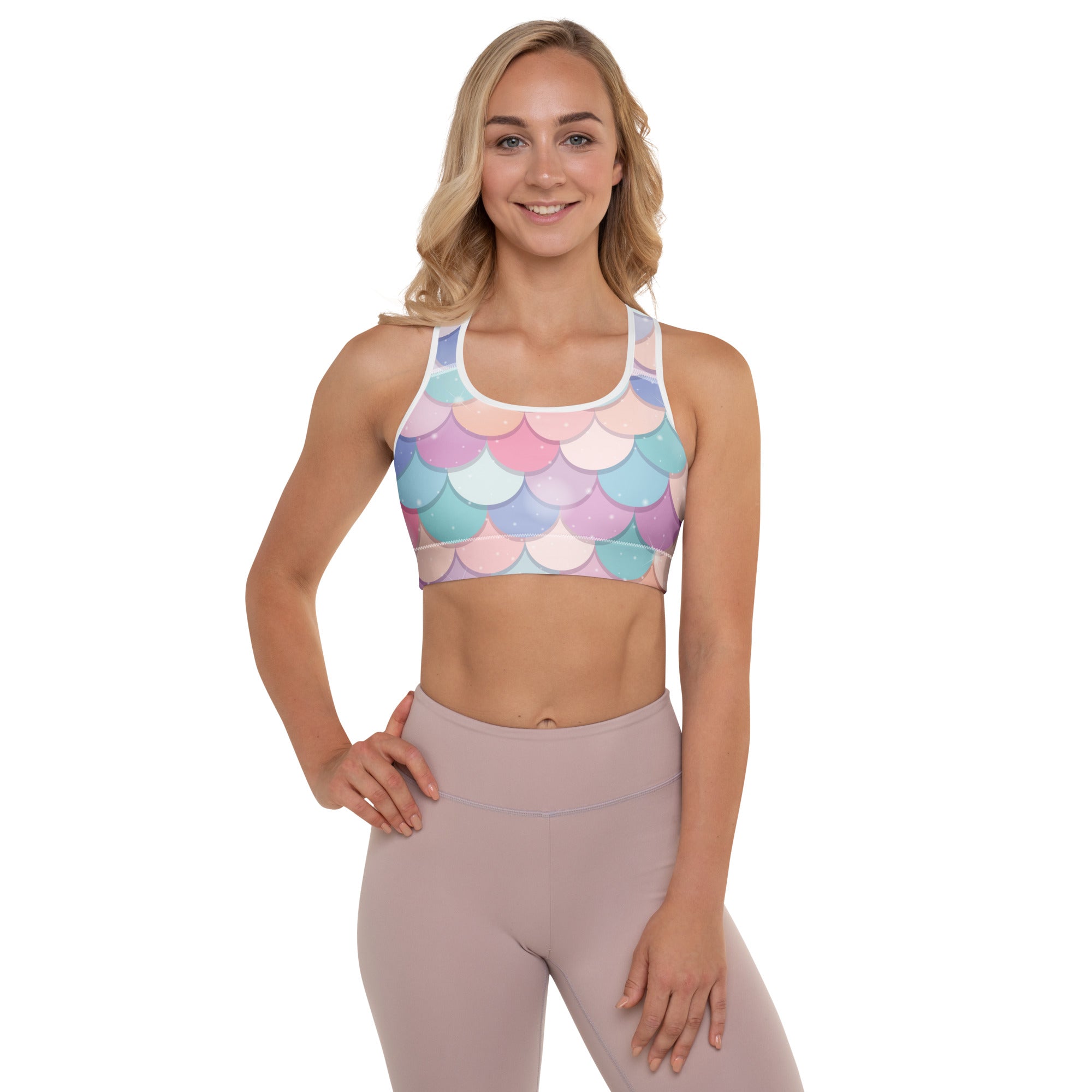 Women’s pastel-colored rainbow mermaid scale padded sports bra with white trim buttery soft supportive quick-dry