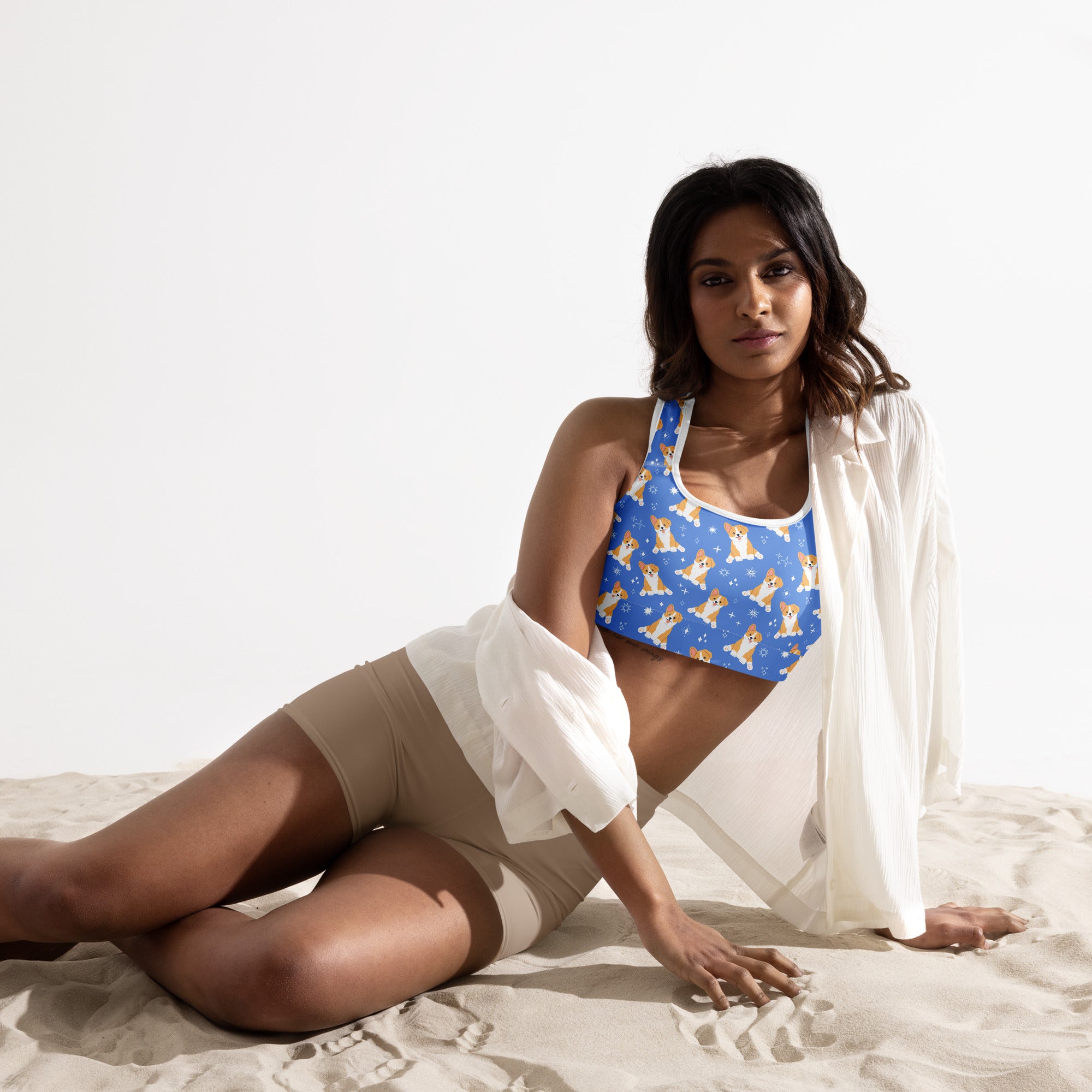 Women’s blue padded sports bra with light brown corgi dog pattern on breathable quick-dry fabric