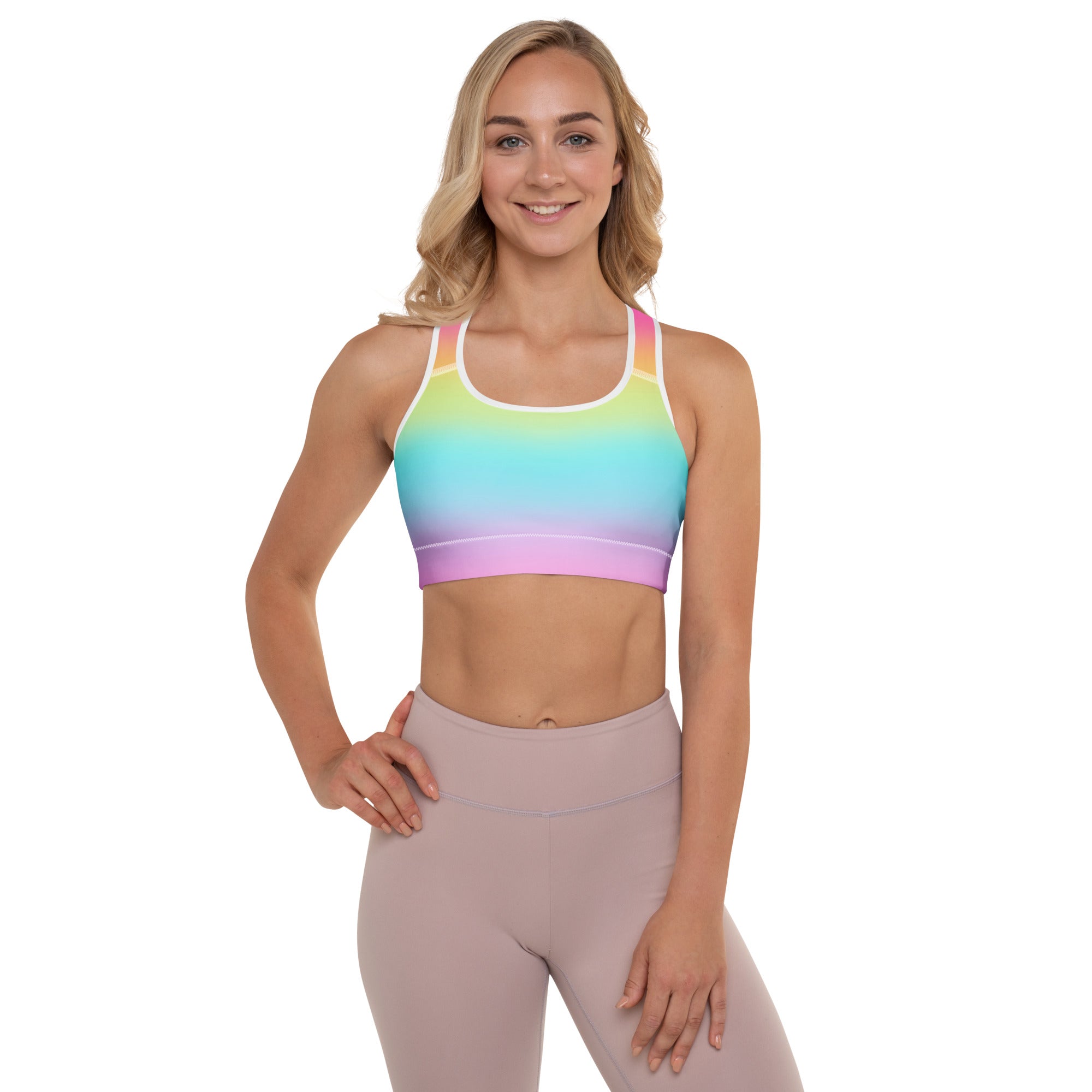 Women’s bright rainbow padded sports bra with white trim, buttery soft fabric, supportive and quick-dry design