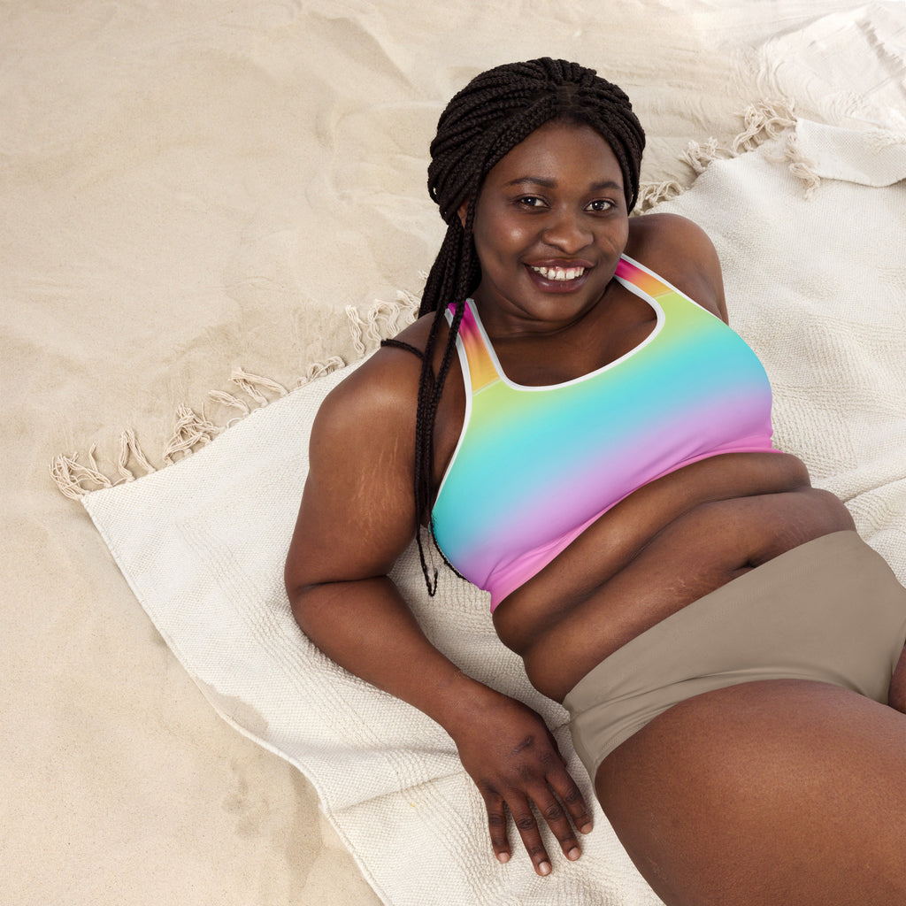 Women’s bright rainbow padded sports bra with thin black straps white trim buttery soft supportive quick-dry