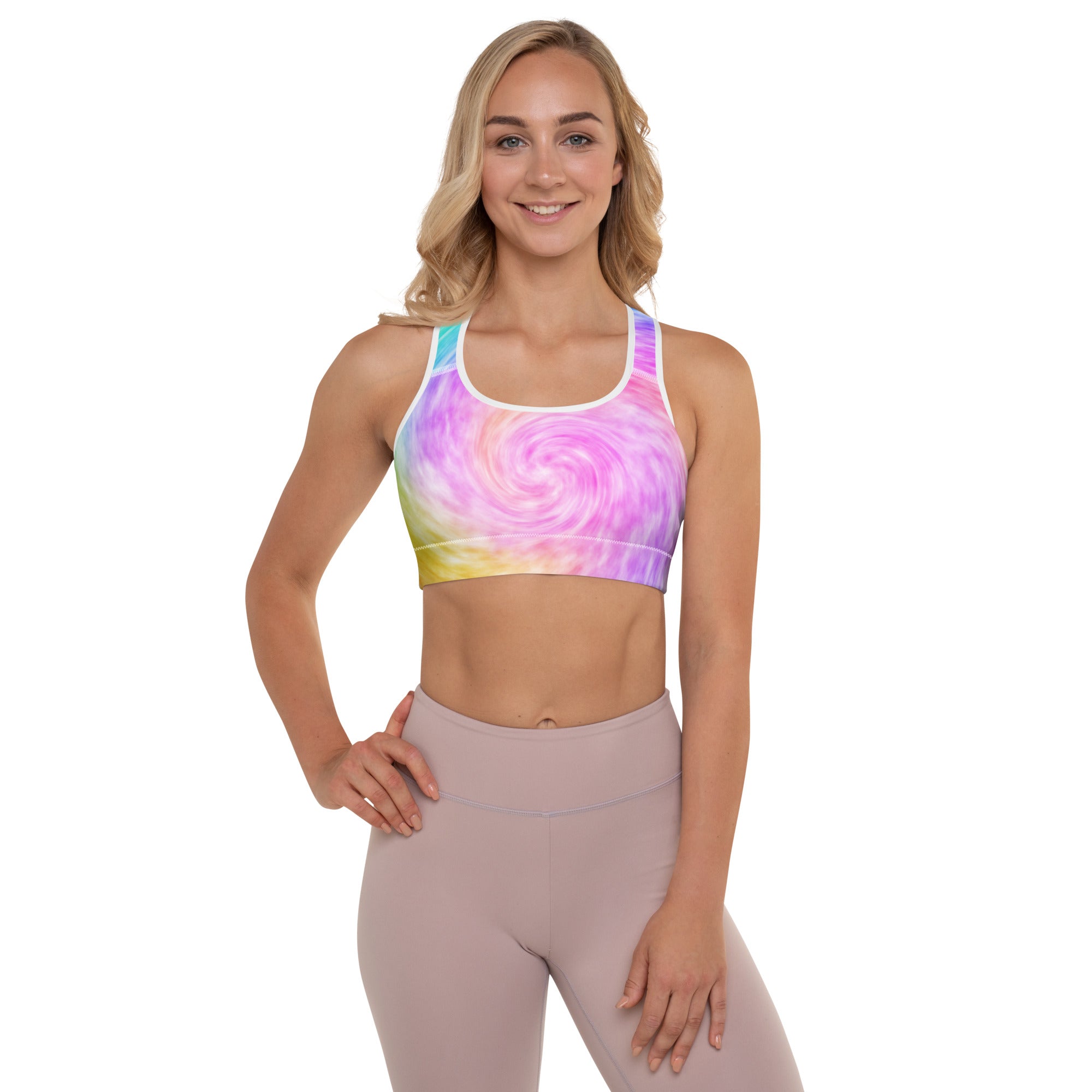 Women’s vibrant rainbow tie dye padded sports bra with white trim made from buttery soft supportive quick dry fabric