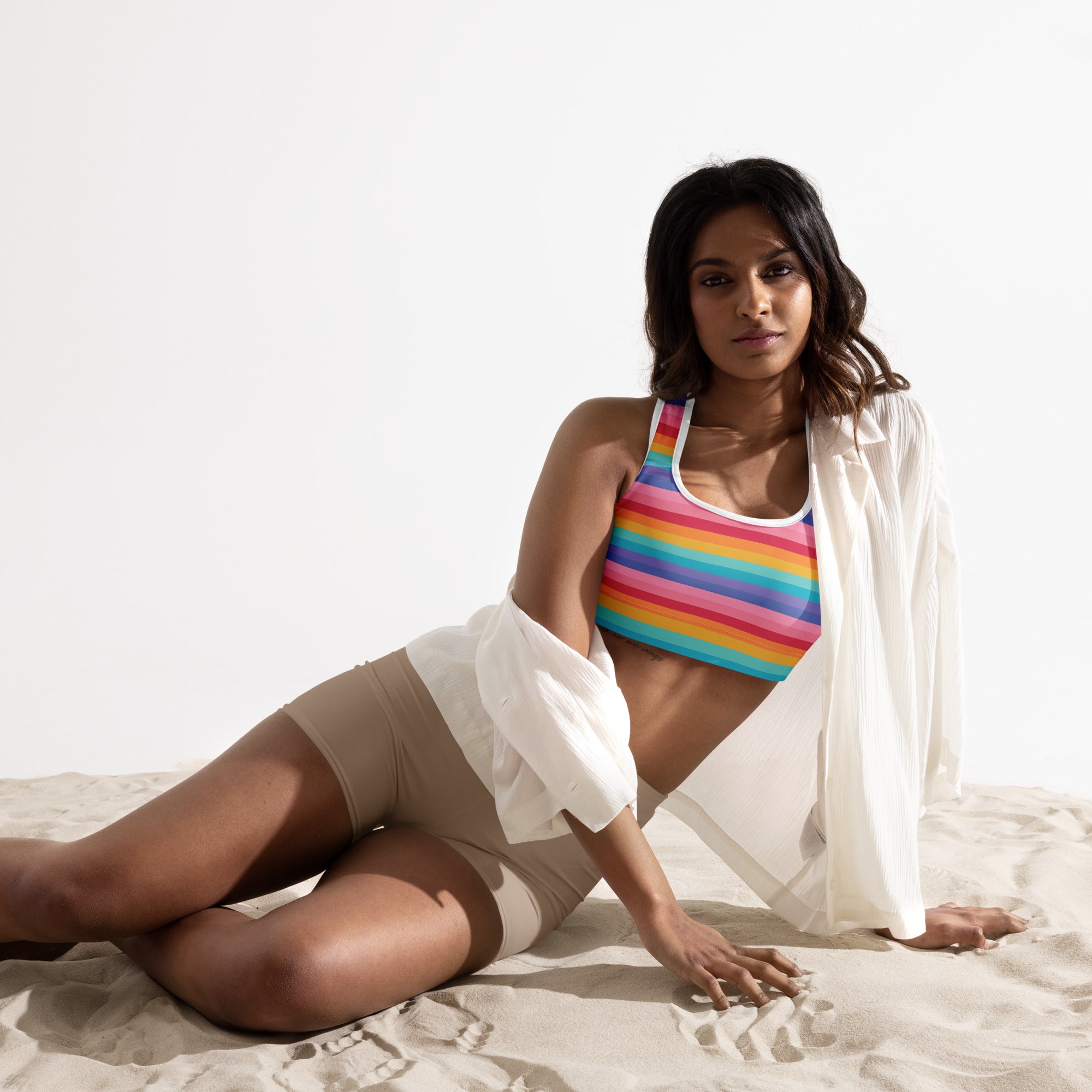 Women’s bright striped rainbow padded sports bra with white trim buttery soft supportive and quick-dry material