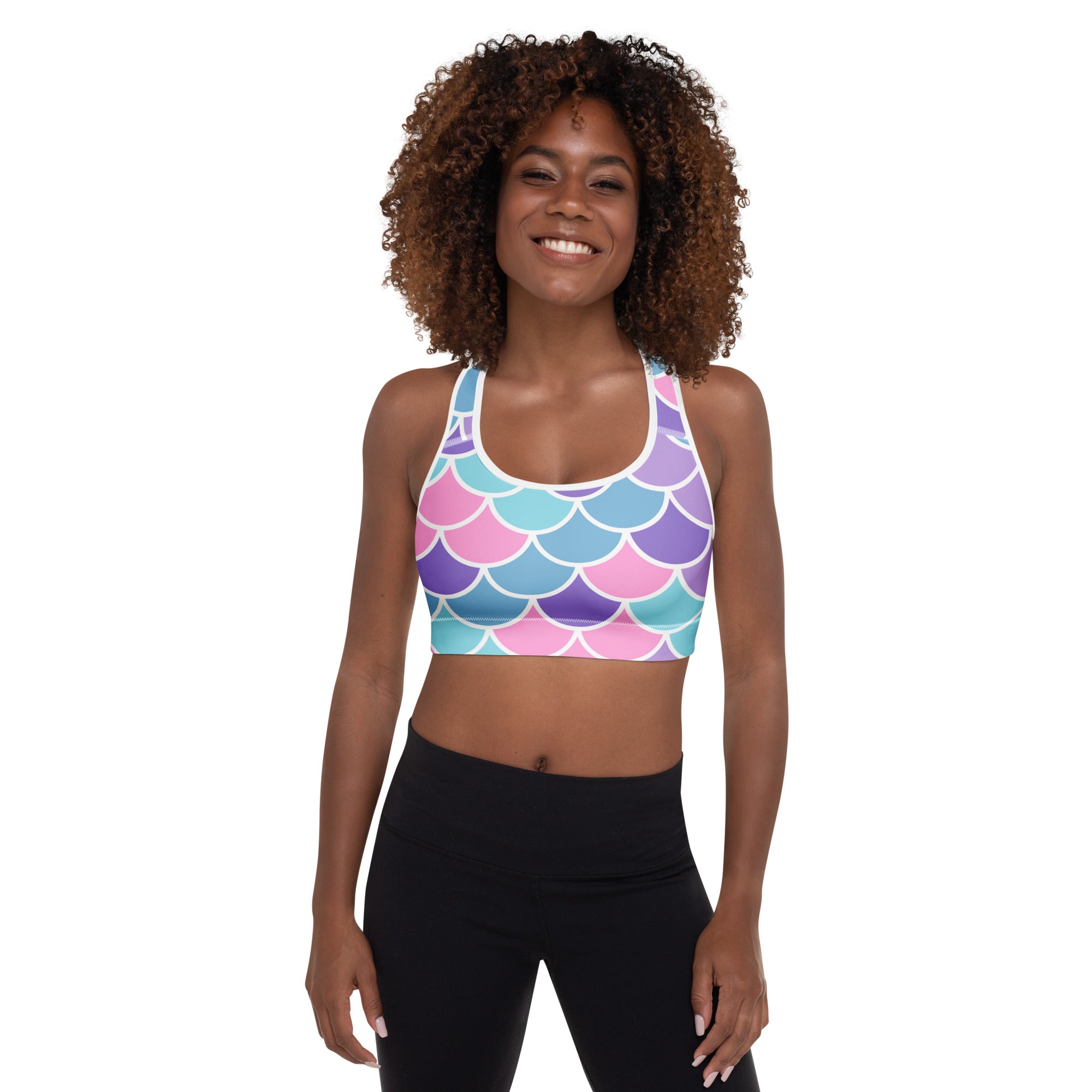 Women’s mermaid scale padded sports bra in pink purple teal iridescent pattern with white outlines, soft supportive quick-dry