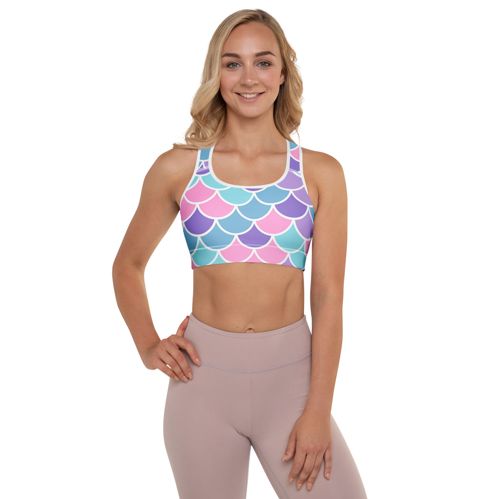 Women’s mermaid scale padded sports bra in pastel pink blue and purple with white outlines buttery soft supportive and quick dry
