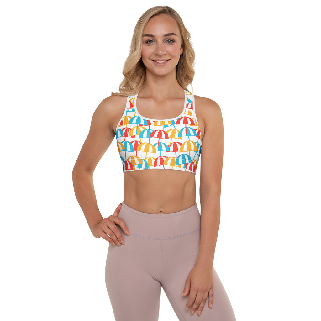Women’s white padded sports bra with multicolored beach umbrella pattern, buttery soft, supportive, and quick-dry material