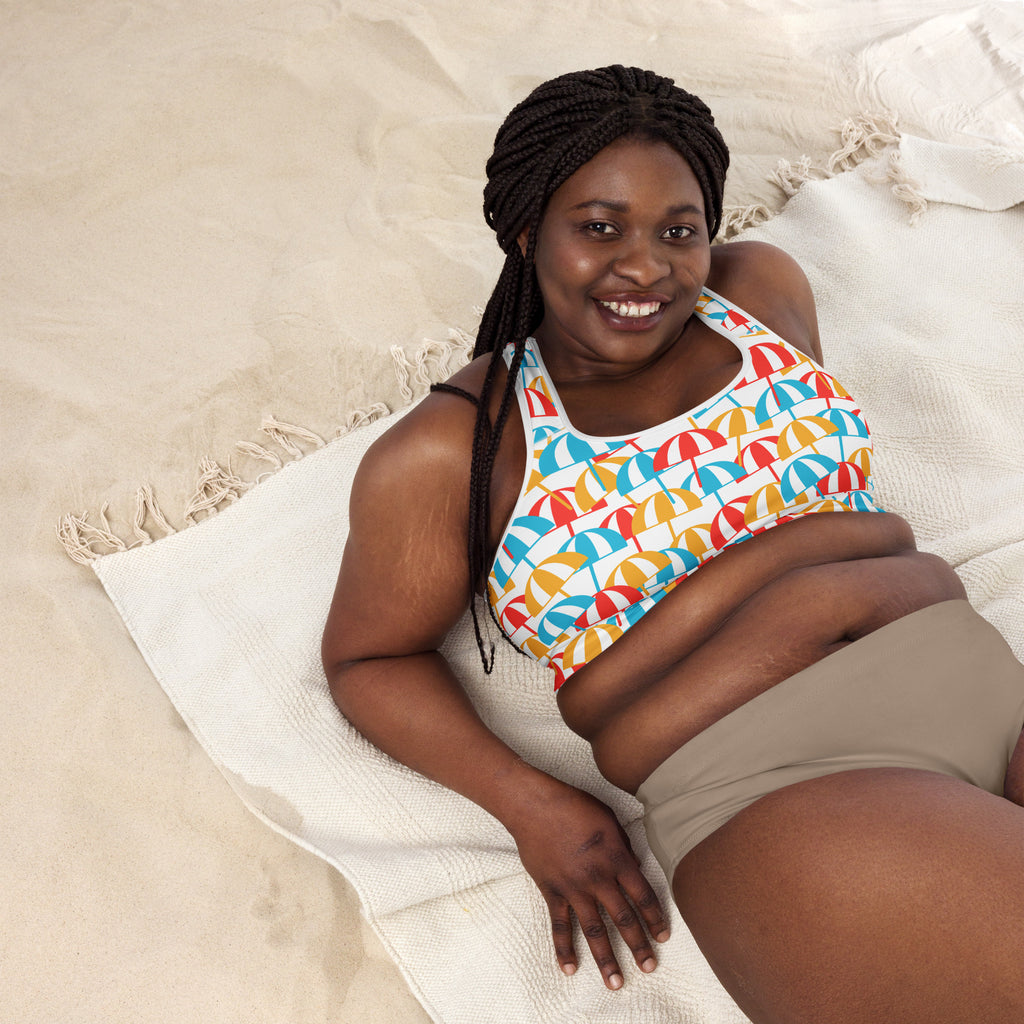 Women’s beach umbrella padded sports bra with vibrant red blue and yellow umbrella pattern on buttery soft quick-dry fabric
