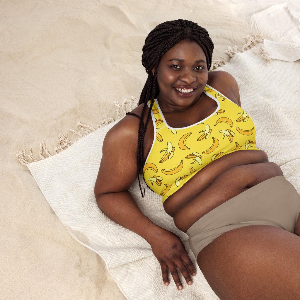 Women’s yellow banana-print padded sports bra with buttery soft fabric, supportive fit, and quick-dry material