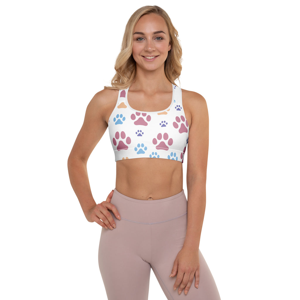 White padded sports bra with colorful pink blue and orange paw prints buttery soft supportive quick-dry fabric