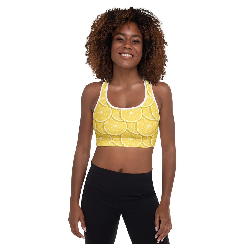 Women’s lemon slice print padded sports bra in yellow with white trim made of buttery soft quick-dry fabric