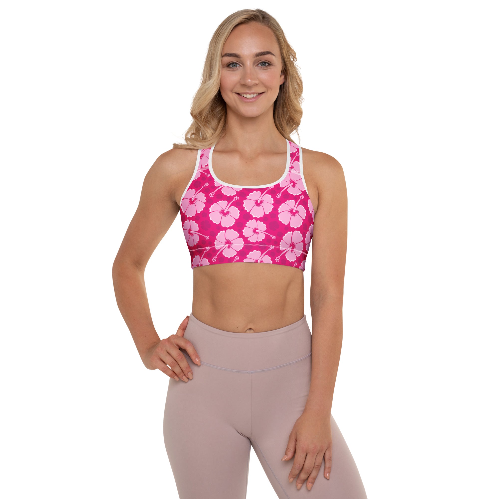 Women’s pink hibiscus floral padded sports bra with white trim buttery soft supportive and quick-dry fabric