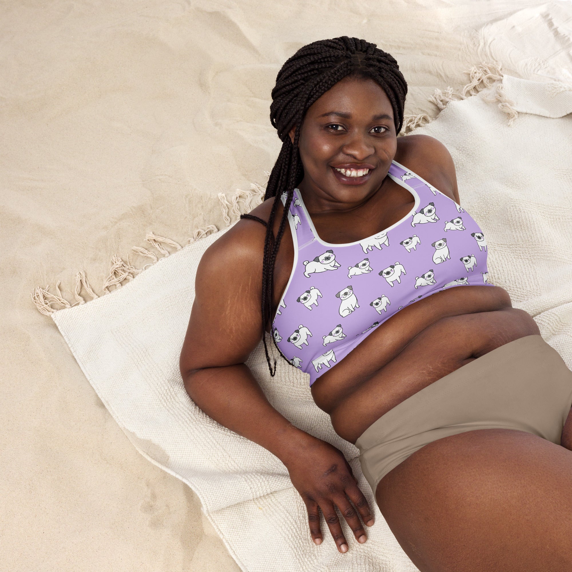 Women’s purple pug padded sports bra with buttery soft fabric and playful white pug dog pattern for support and quick drying