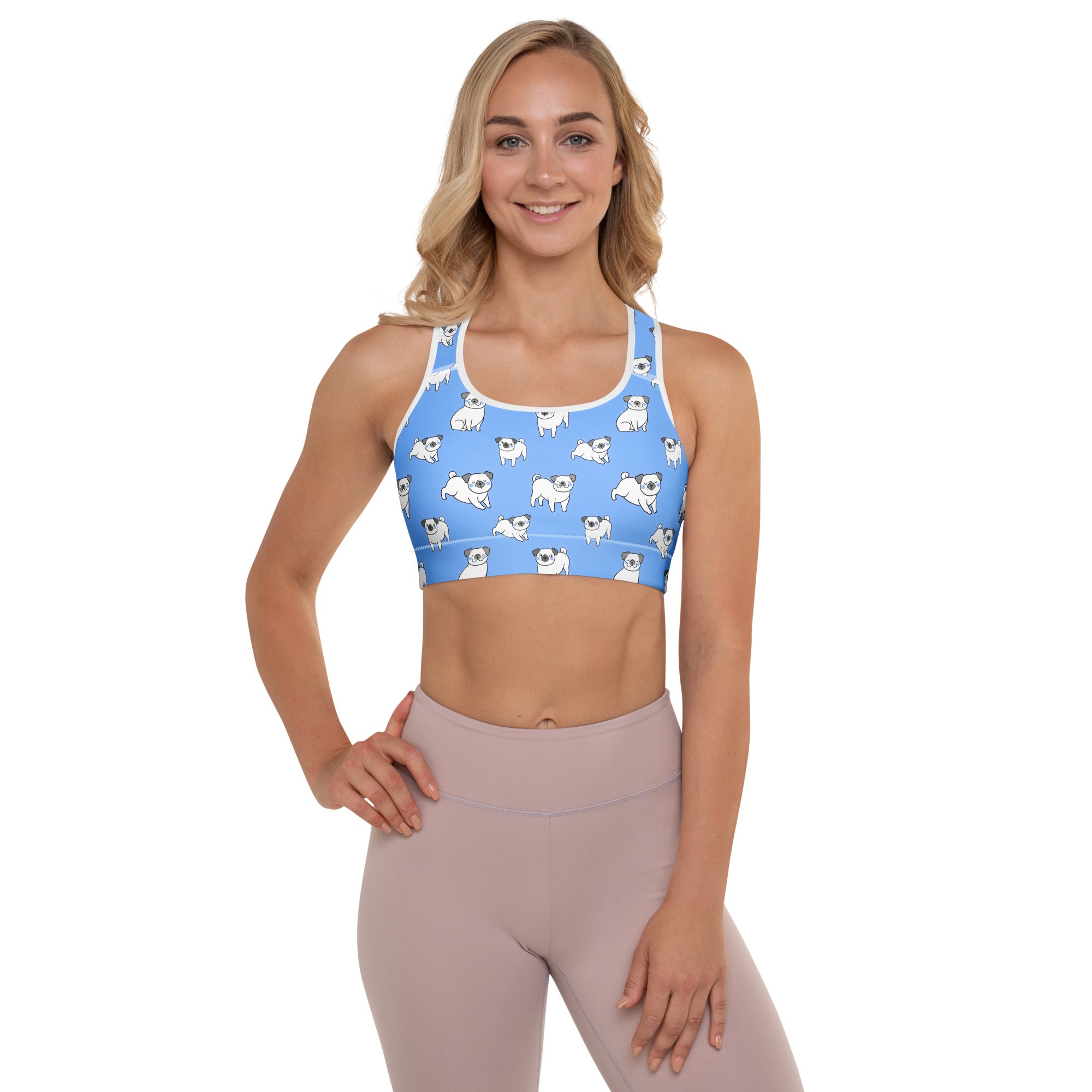 Women’s light blue padded sports bra with white pug pattern, buttery soft, supportive, and quick-dry material