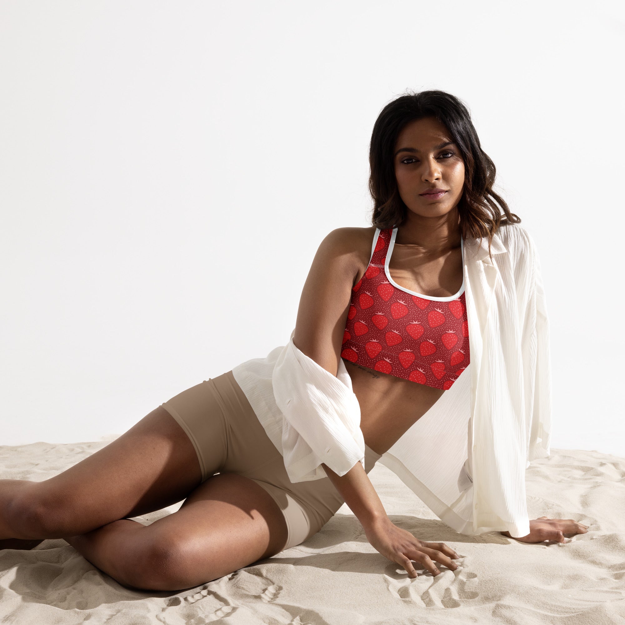 Women’s red strawberry padded sports bra with white trim buttery soft supportive and quick-dry material