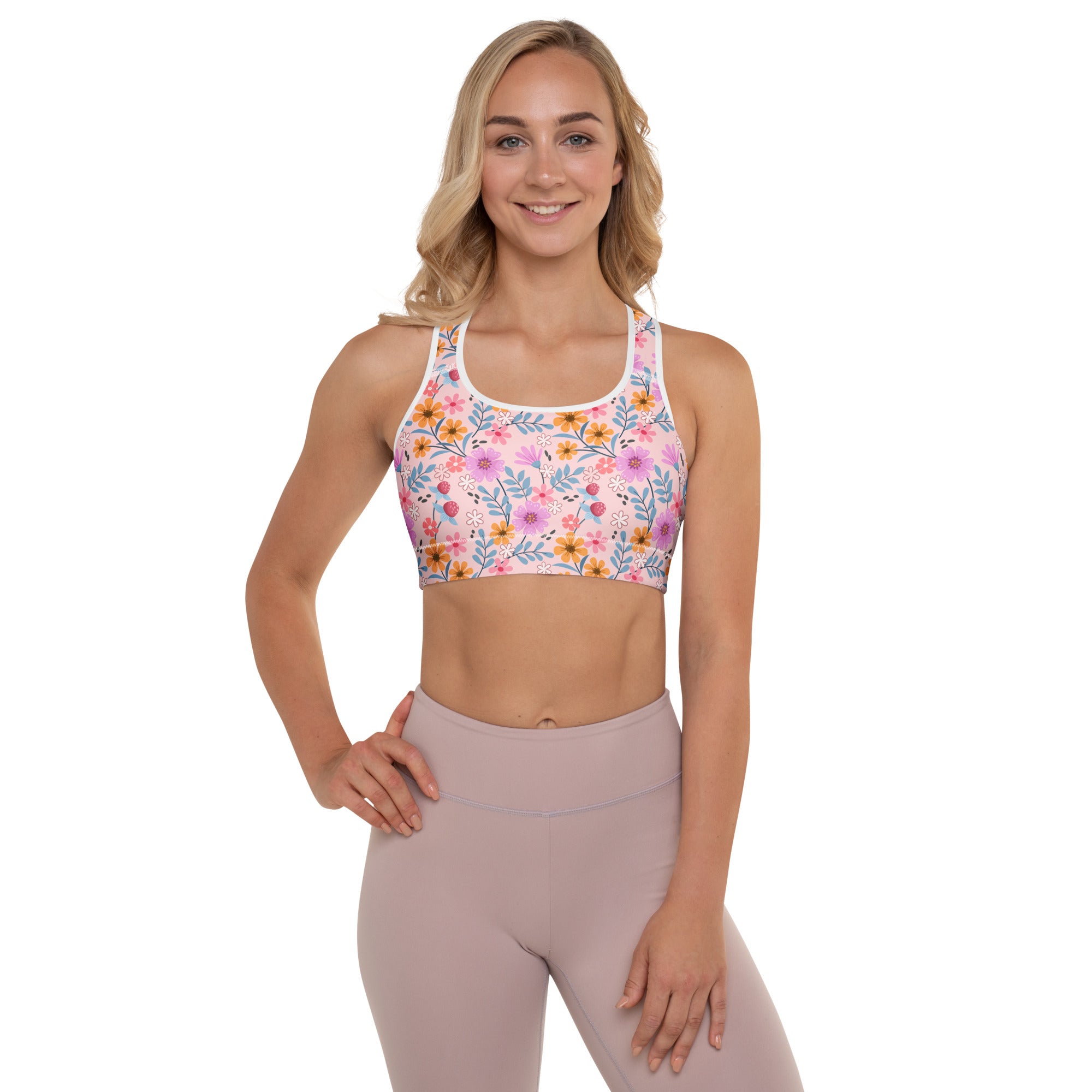 Women’s pink floral print padded sports bra with delicate yellow orange purple and green blossoms buttery soft and quick dry
