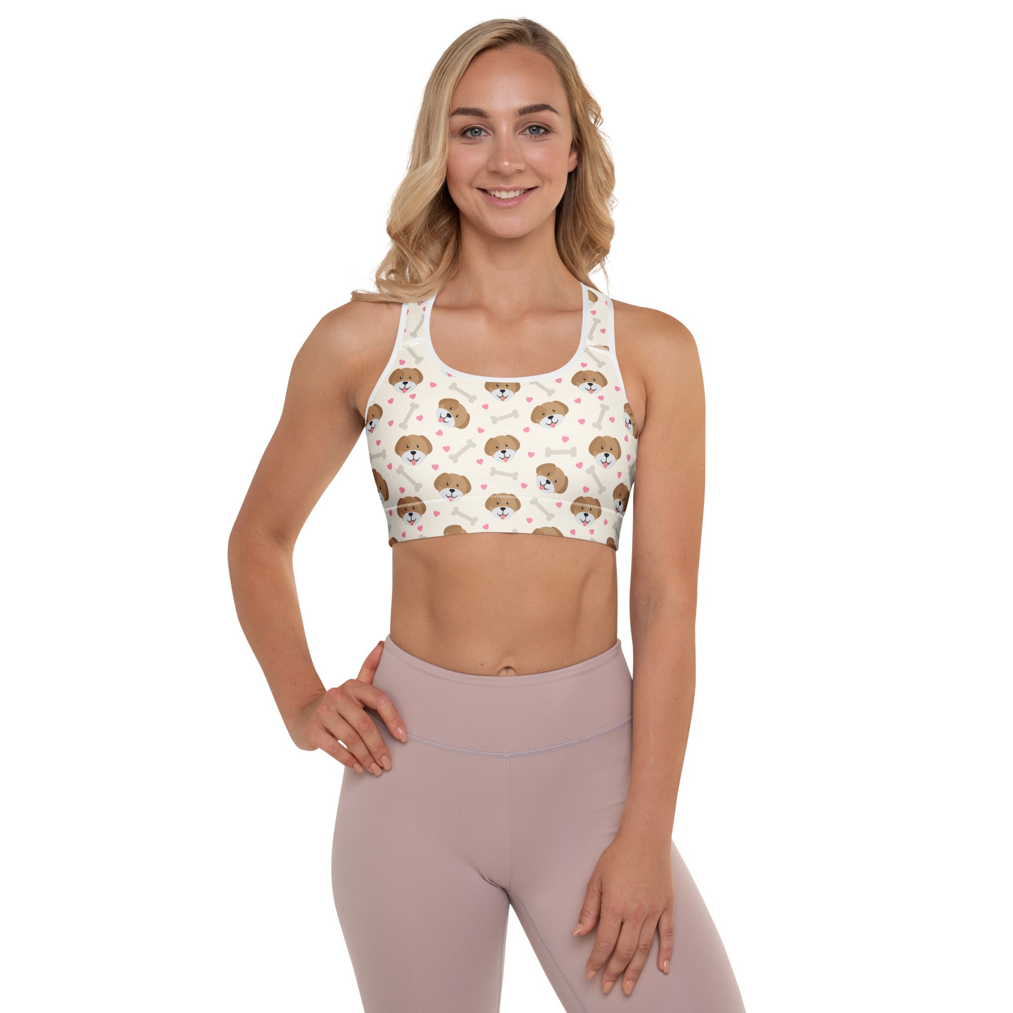 White womens puppy print padded sports bra with brown dog faces and bones, buttery soft supportive quick dry material