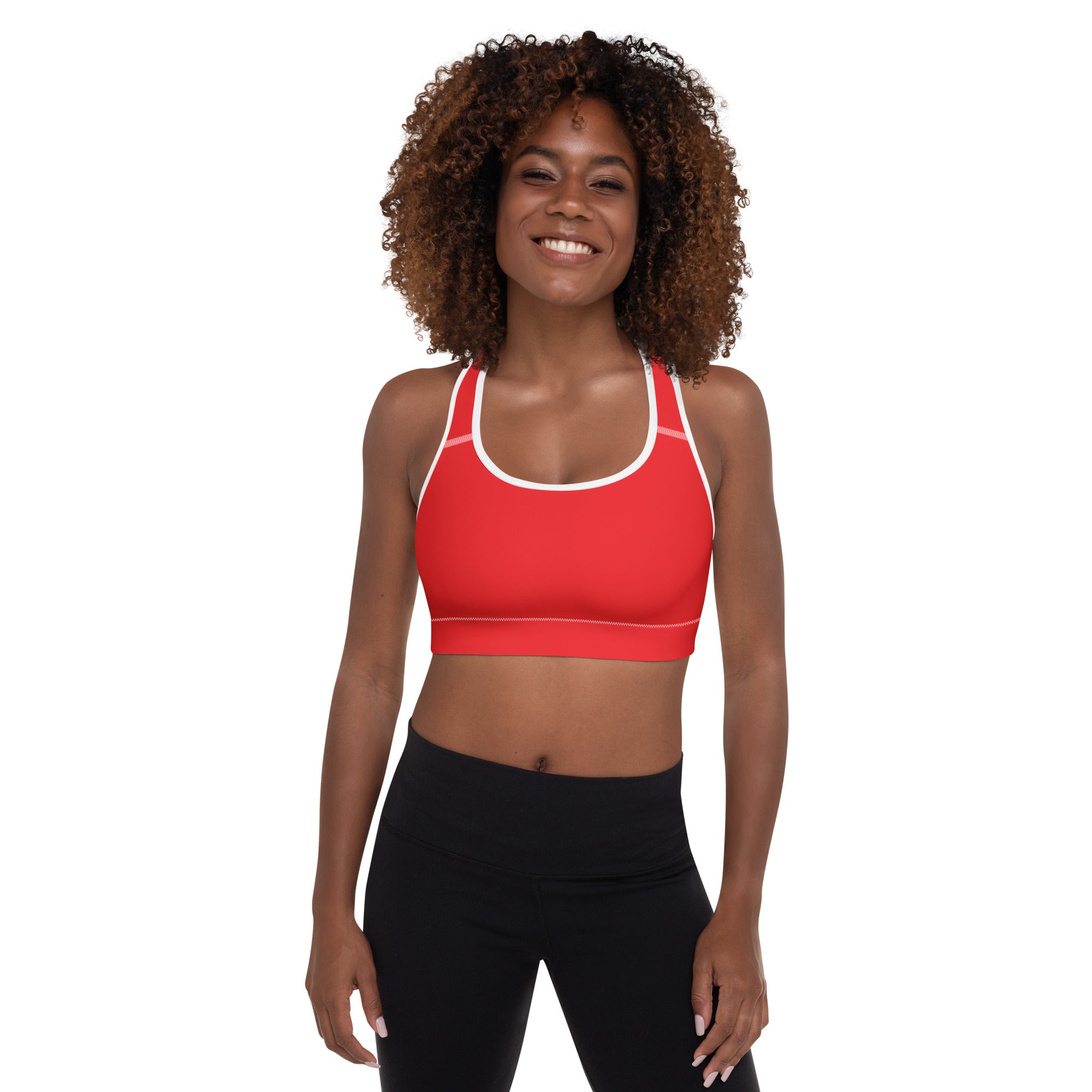 Women’s red padded sports bra with white trim featuring a supportive seamless design and quick-dry buttery soft fabric