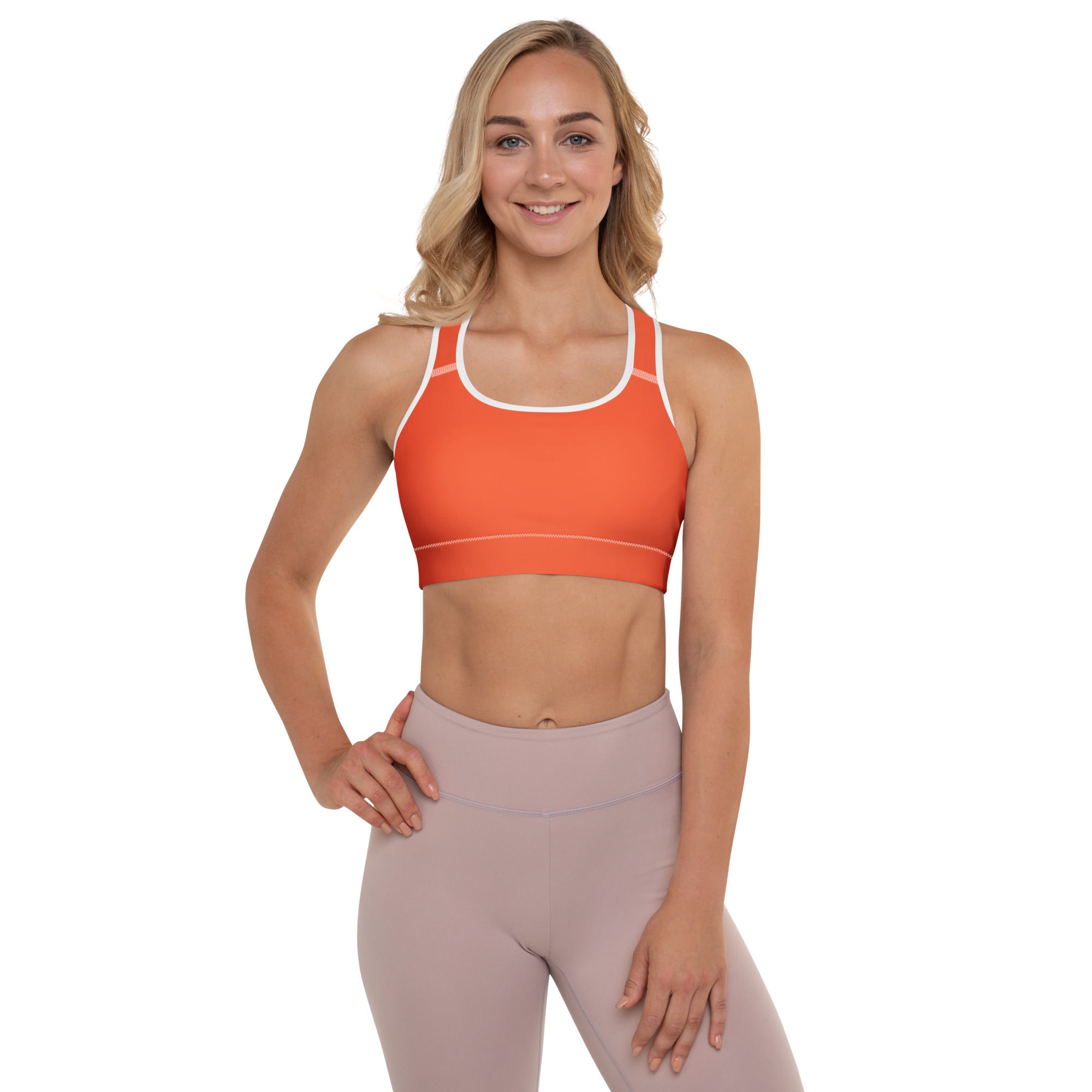 Women’s orange padded sports bra with white trim and racerback straps buttery soft supportive and quick-dry