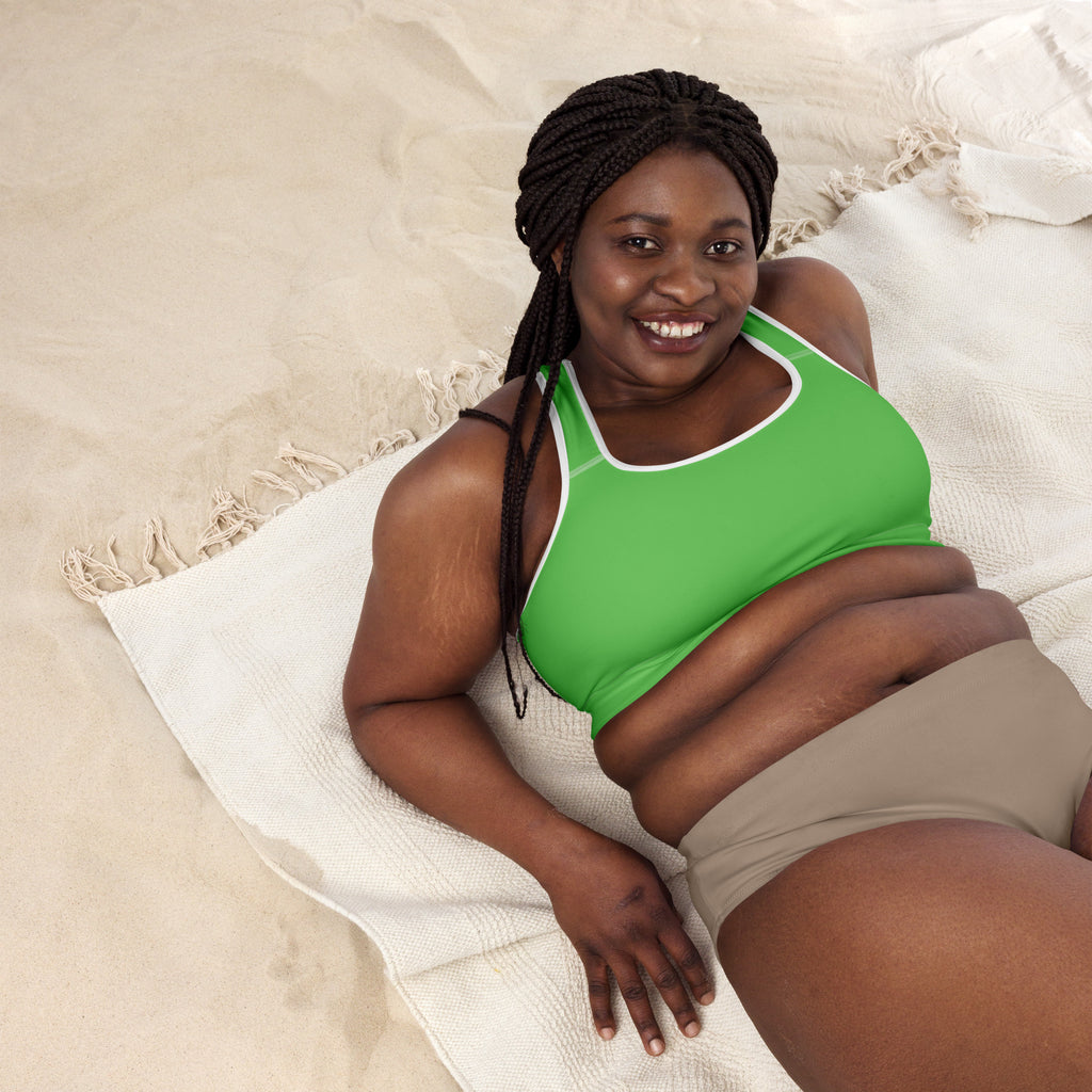 A vibrant green padded women’s sports bra with white trim, buttery soft fabric, supportive fit, and quick-dry material