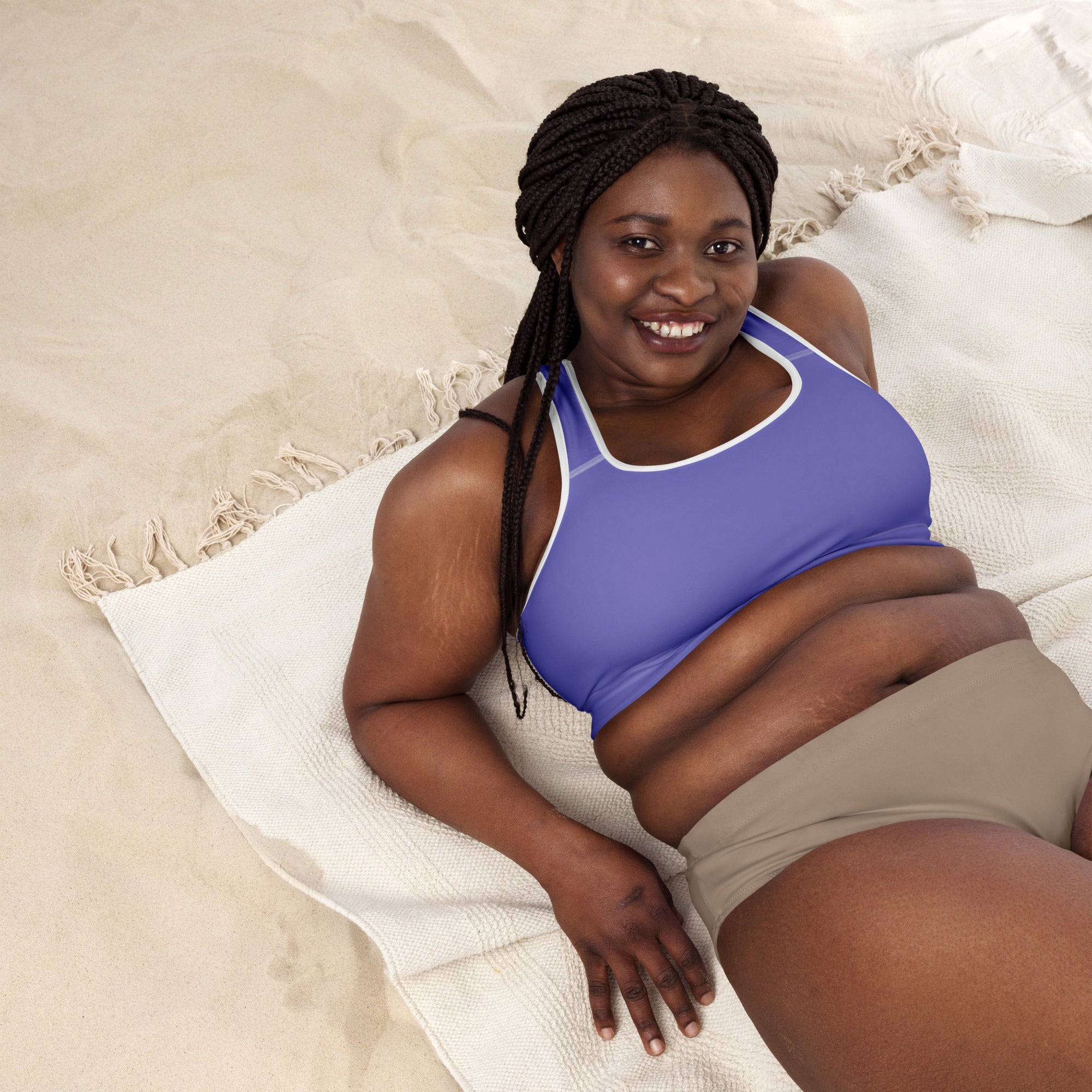 A woman wearing a women’s purple padded sports bra with white trim made of buttery soft, quick-dry fabric